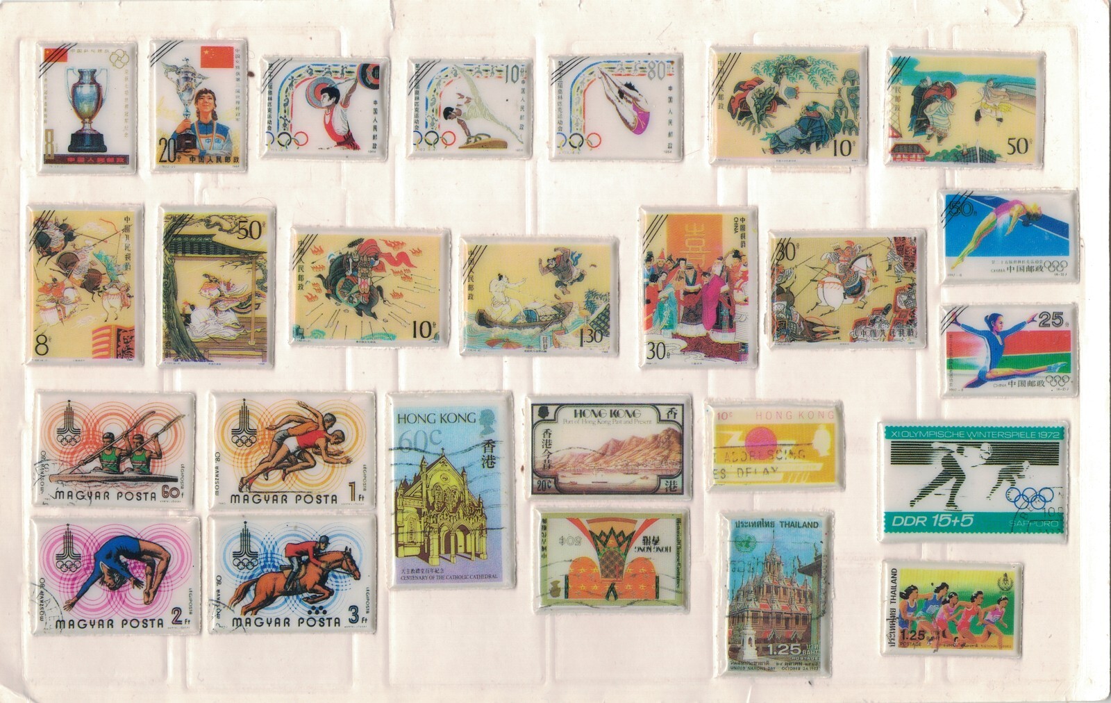 Very Unusual Lot of World Stamps(??) Encased in Padded Plastic w/ Advesive Backs