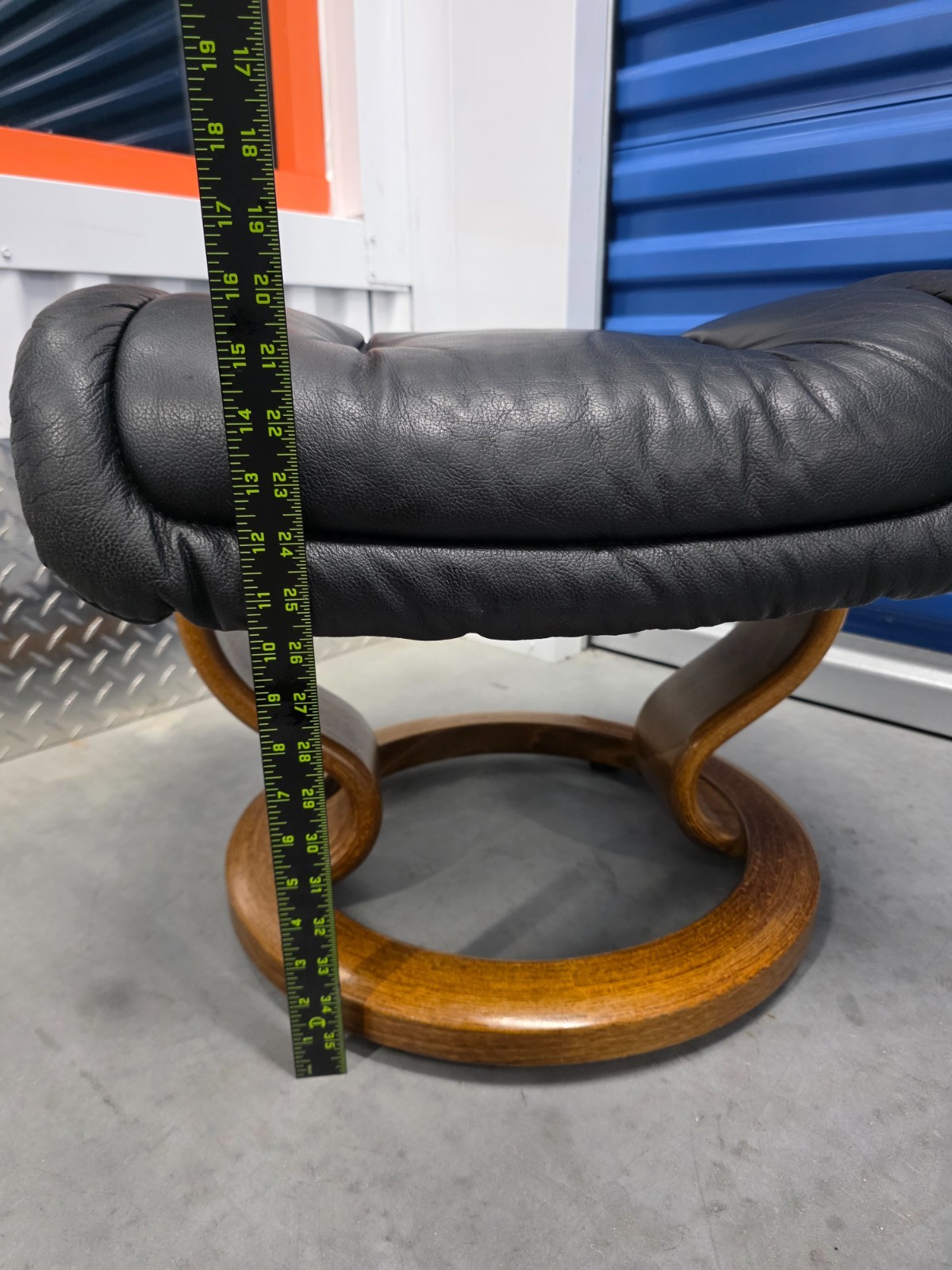 Ekornes Stressless Black Colored Leather Ottoman | Teak Stained Wood Base