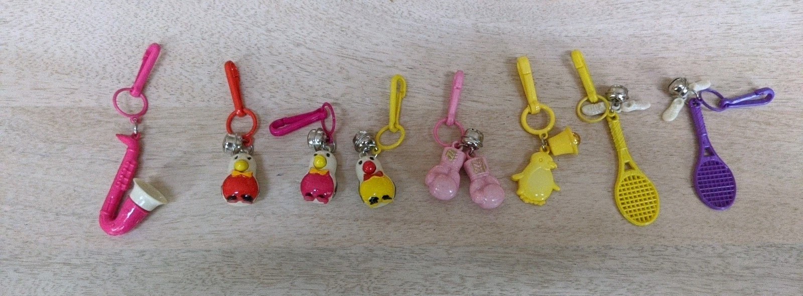 Lot Of 8 Vintage Plastic Clip On Bell Charms Saxophone Without Bell