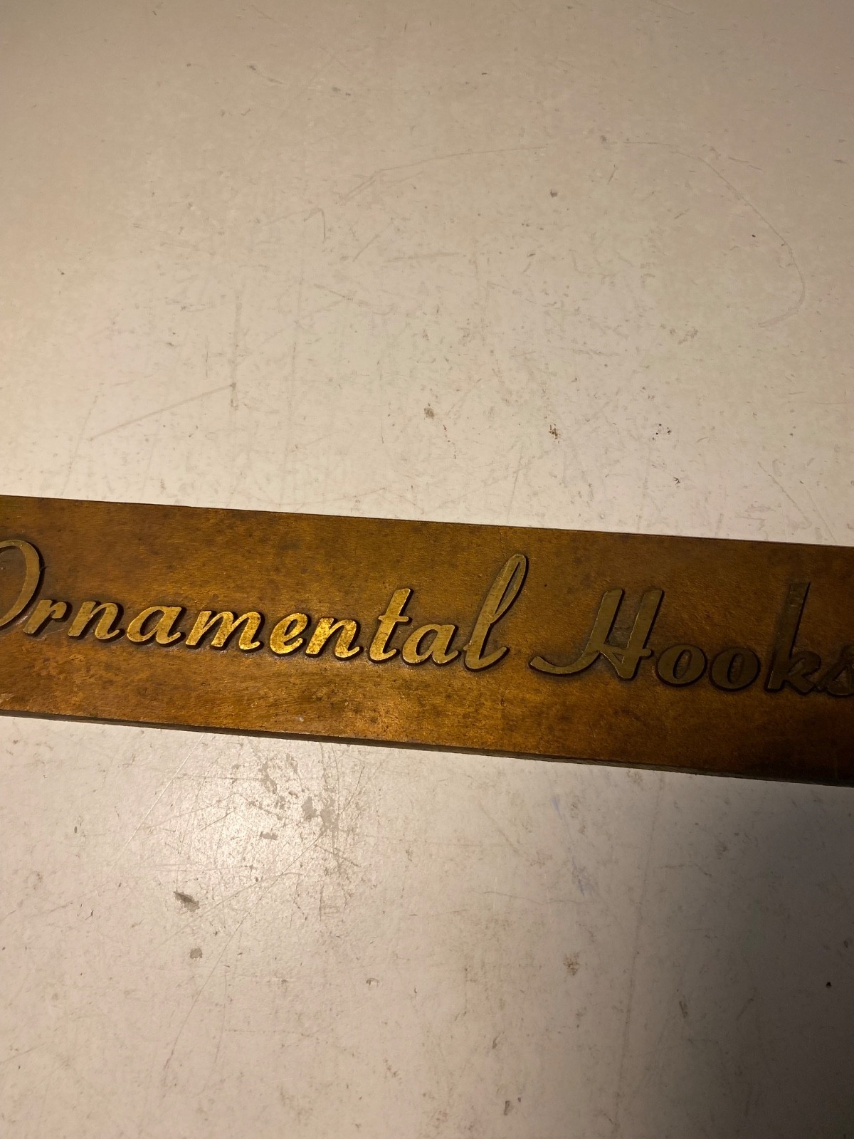 Vintage Metal Ornamental Hooks Sign Plaque