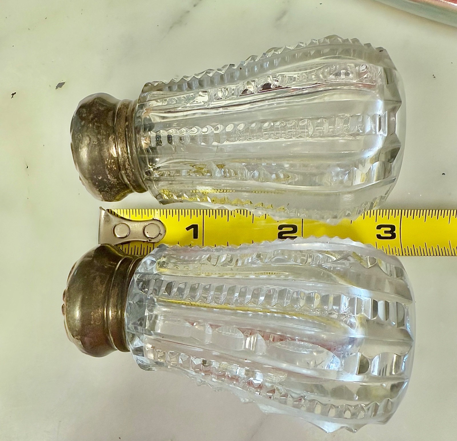 Antique beautiful cut glass with Gilded sterling lids salt and pepper shakers