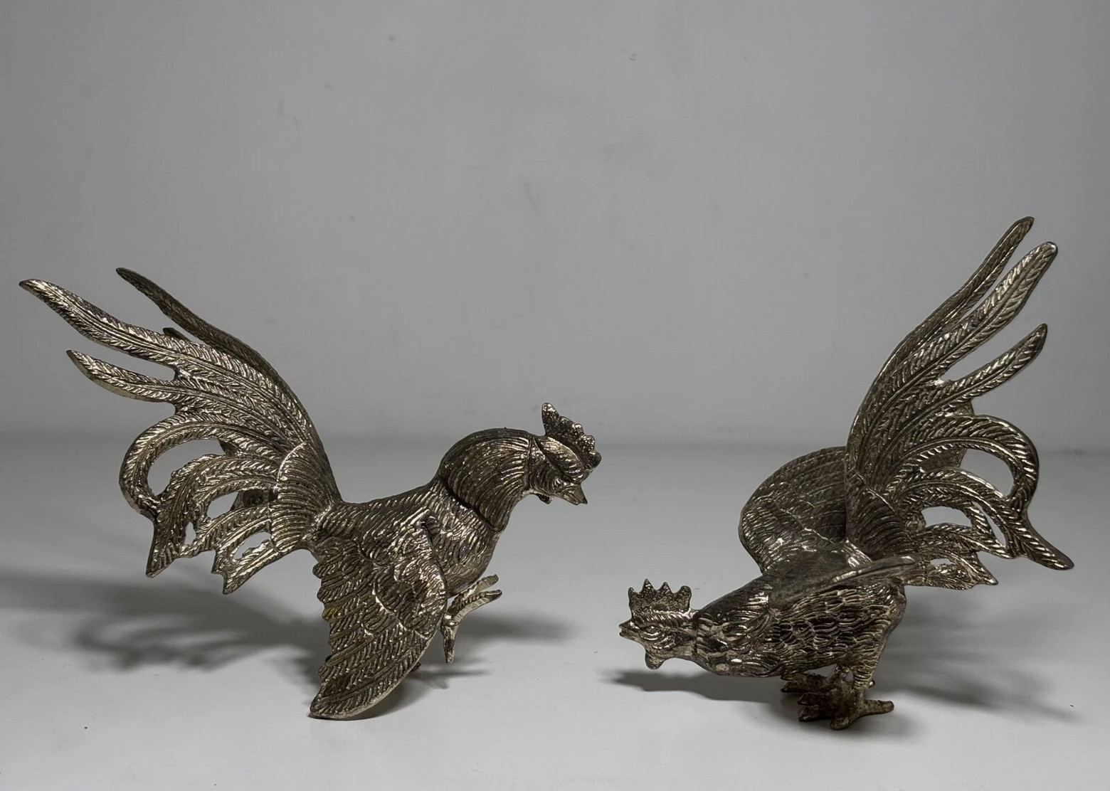 Pair of silver-plated metal fighting roosters, antique bird, rustic decoration