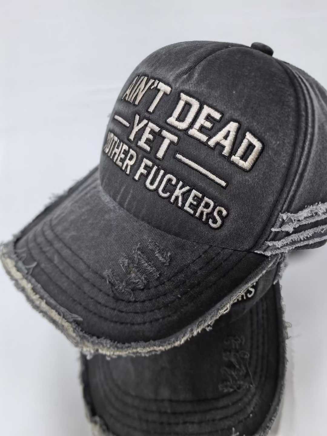 "Ain't Dead Yet" Distressed Washed Black Baseball Cap | Embroidered Dad Hat