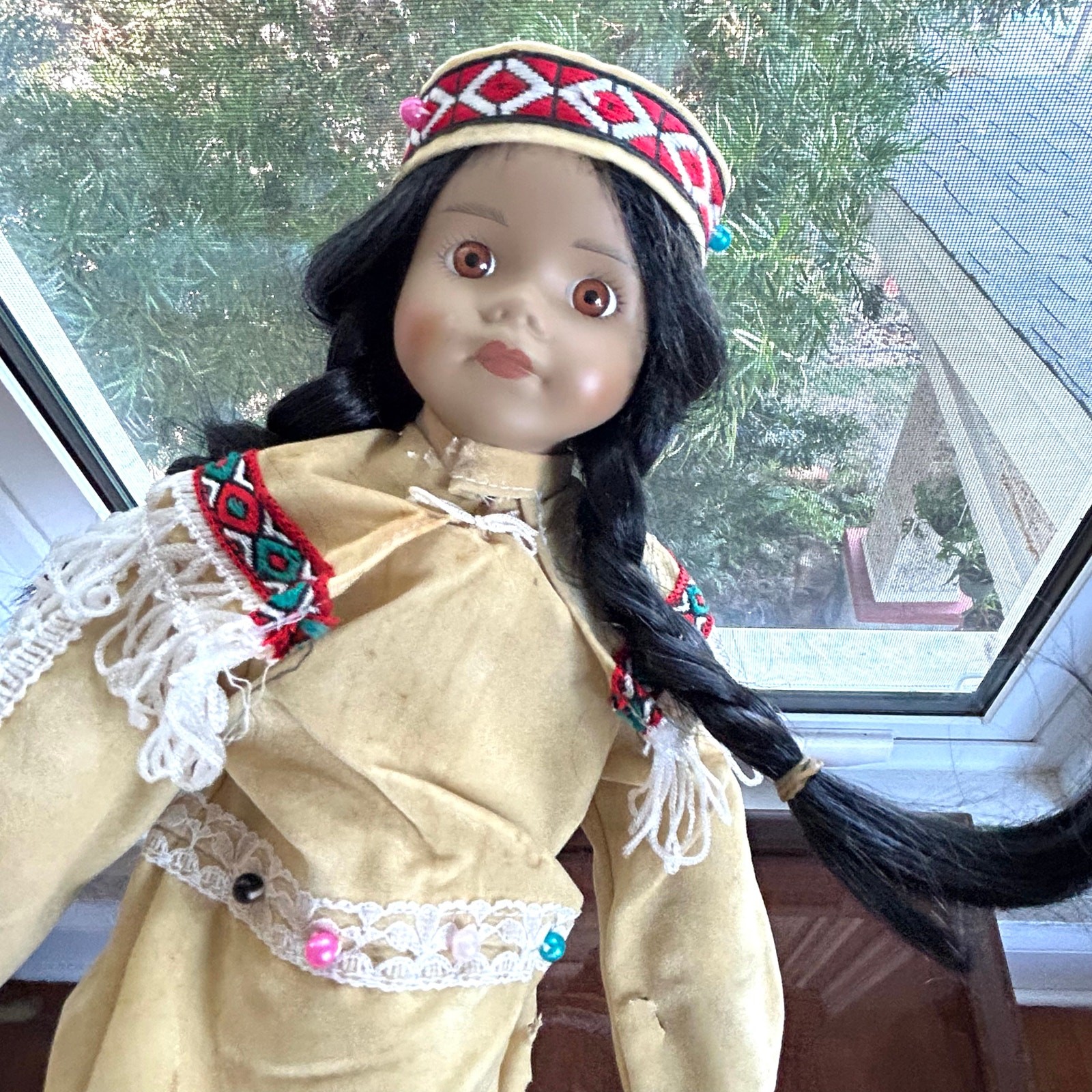 Vintage Porcelain Native American-Inspired Doll with Braids and Beaded Outfit