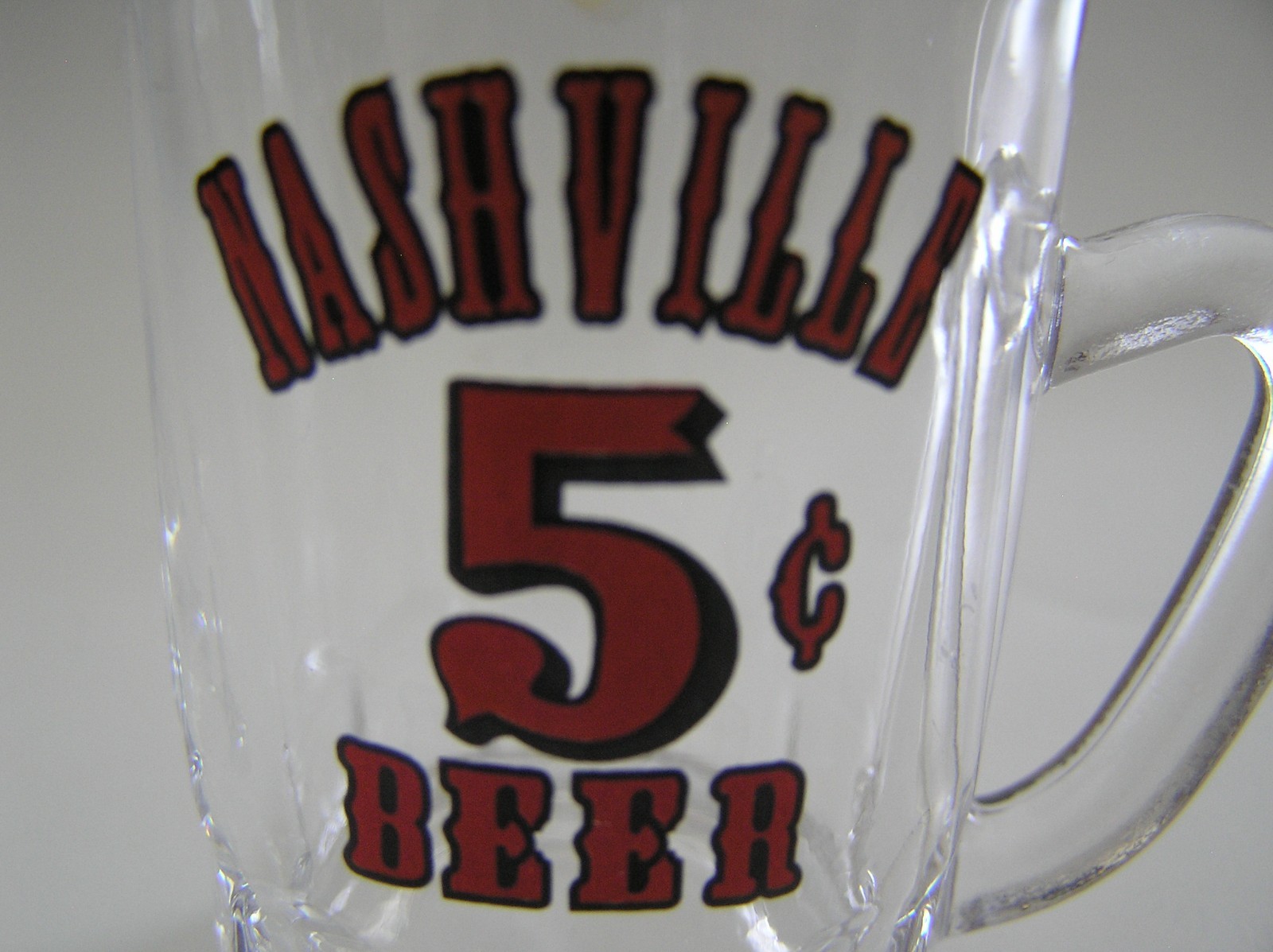 2 Souvenirs Shot Mugs: A Black Rumple Minze and A Clear Nashville 5cents Beer