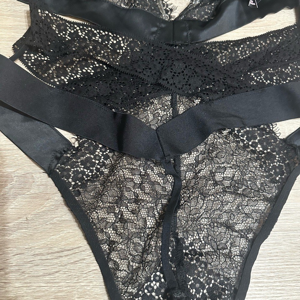 Victorias Secret Black Lace Thong Bodysuit. Size large.