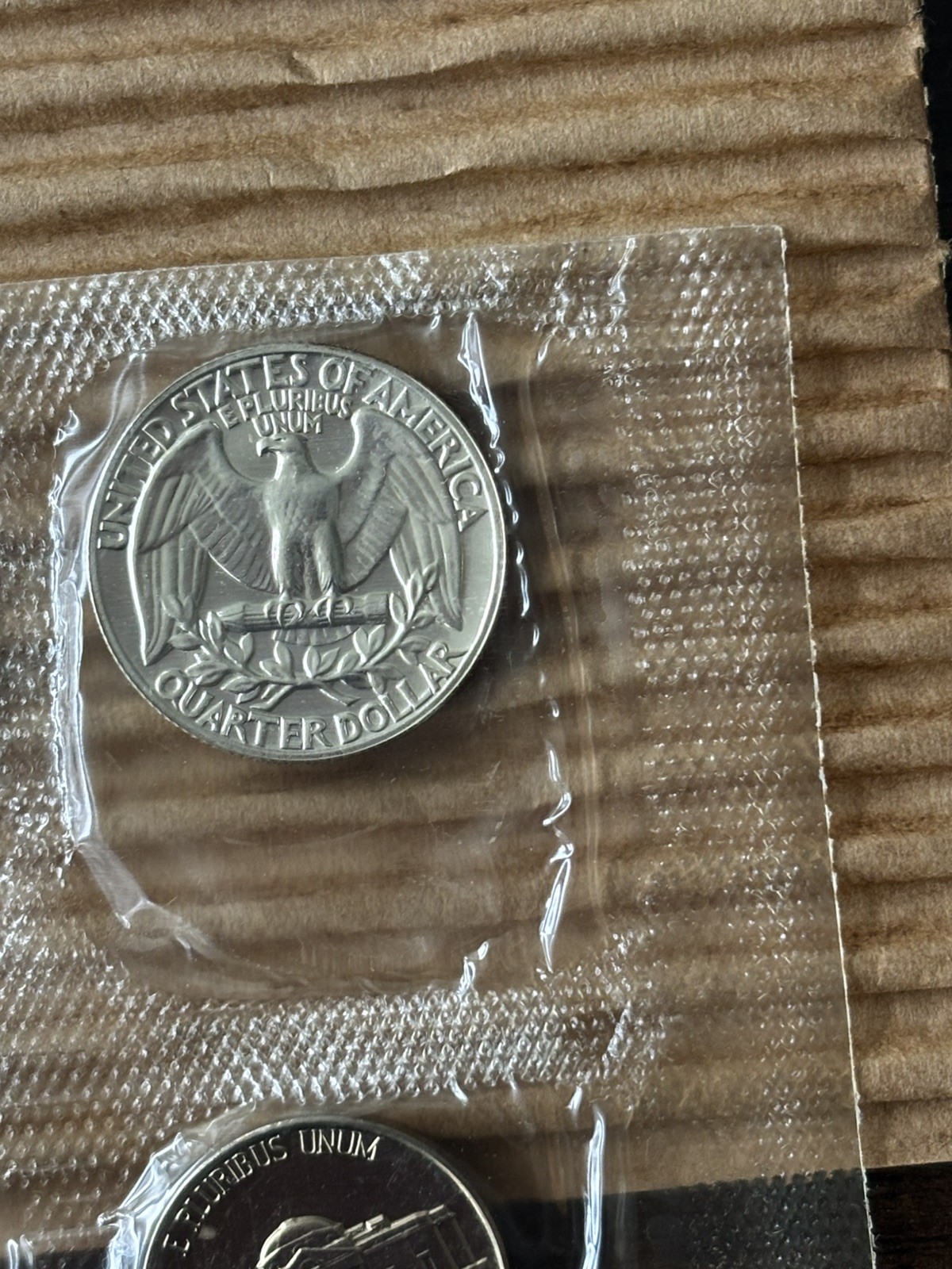 1957 U.S. PROOF SET. Coins U.S. Mint Sealed in a flat cello. (Tear in envelope)