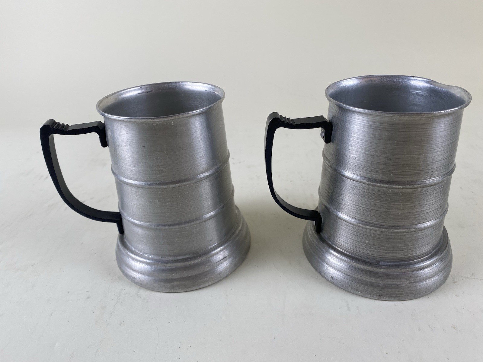Pair Apex Aluminum Pewter Beer Steins Mugs w Glass Bottom Black Handle Hong Kong