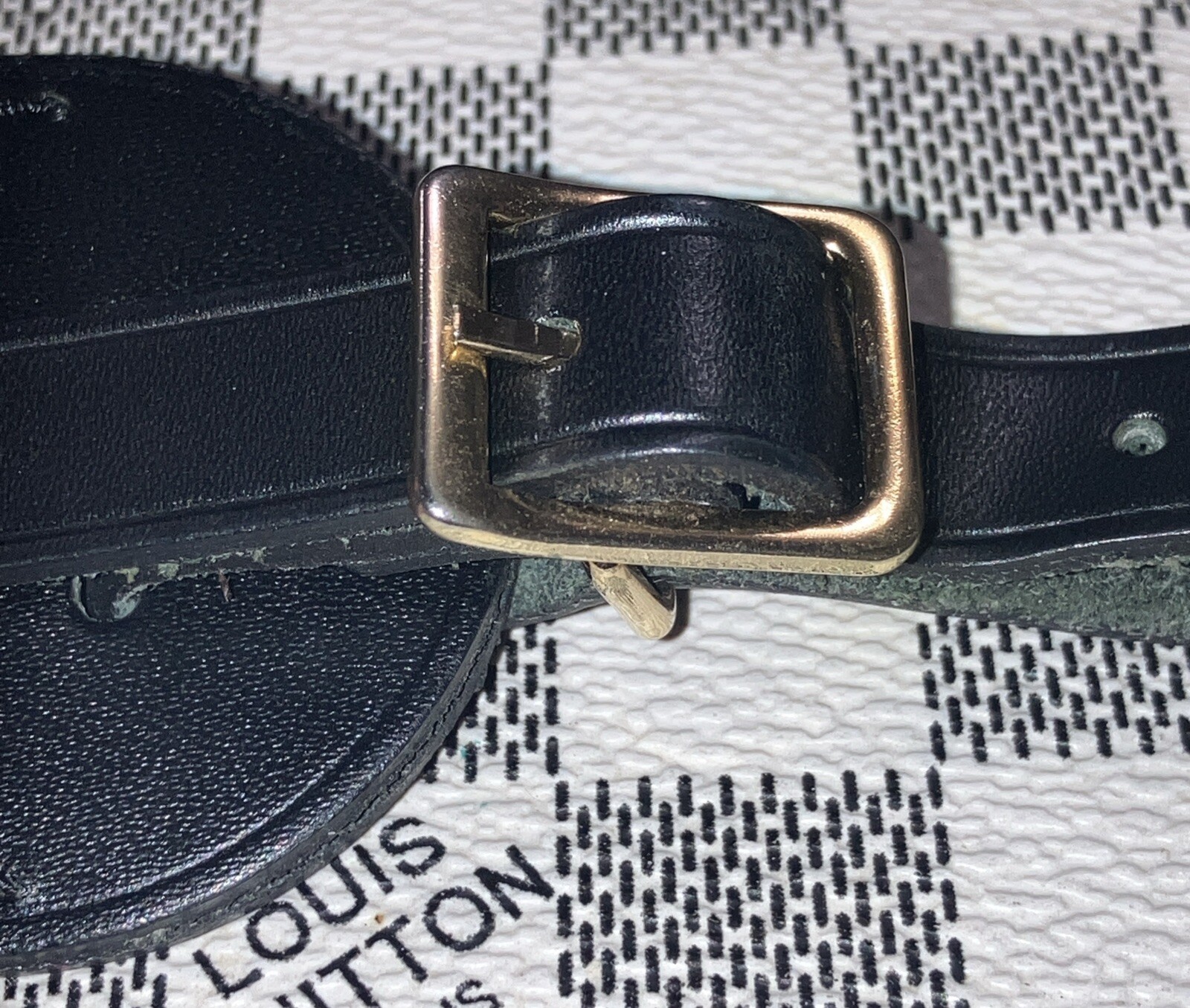 Authentic Louis Vuitton small Black W/ Gold Hardware name tag.