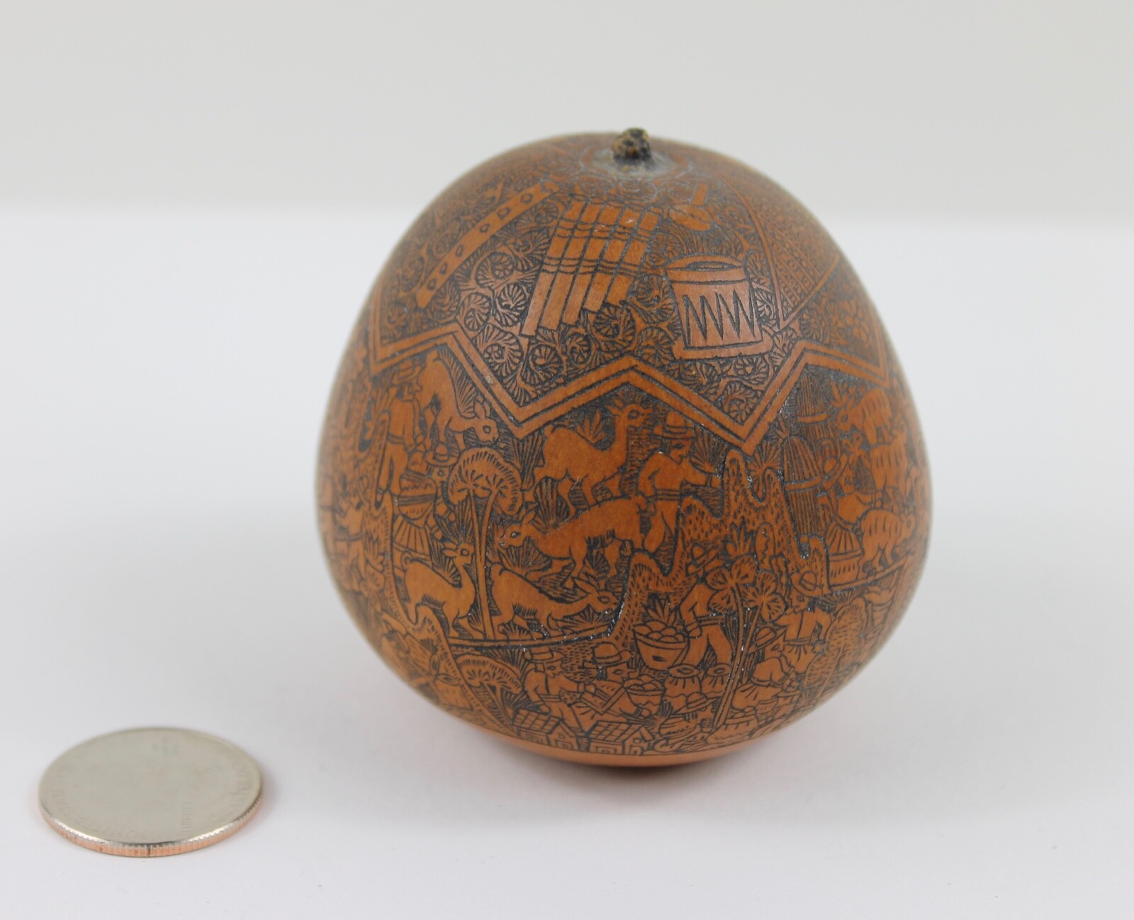 One exquisitely carved Peruvian storytelling gourd village life folk art