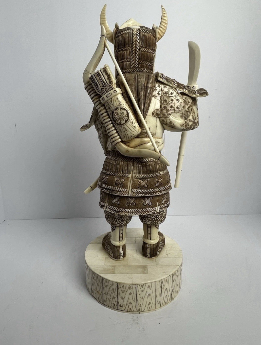 Japanese carved figure is a warrior.