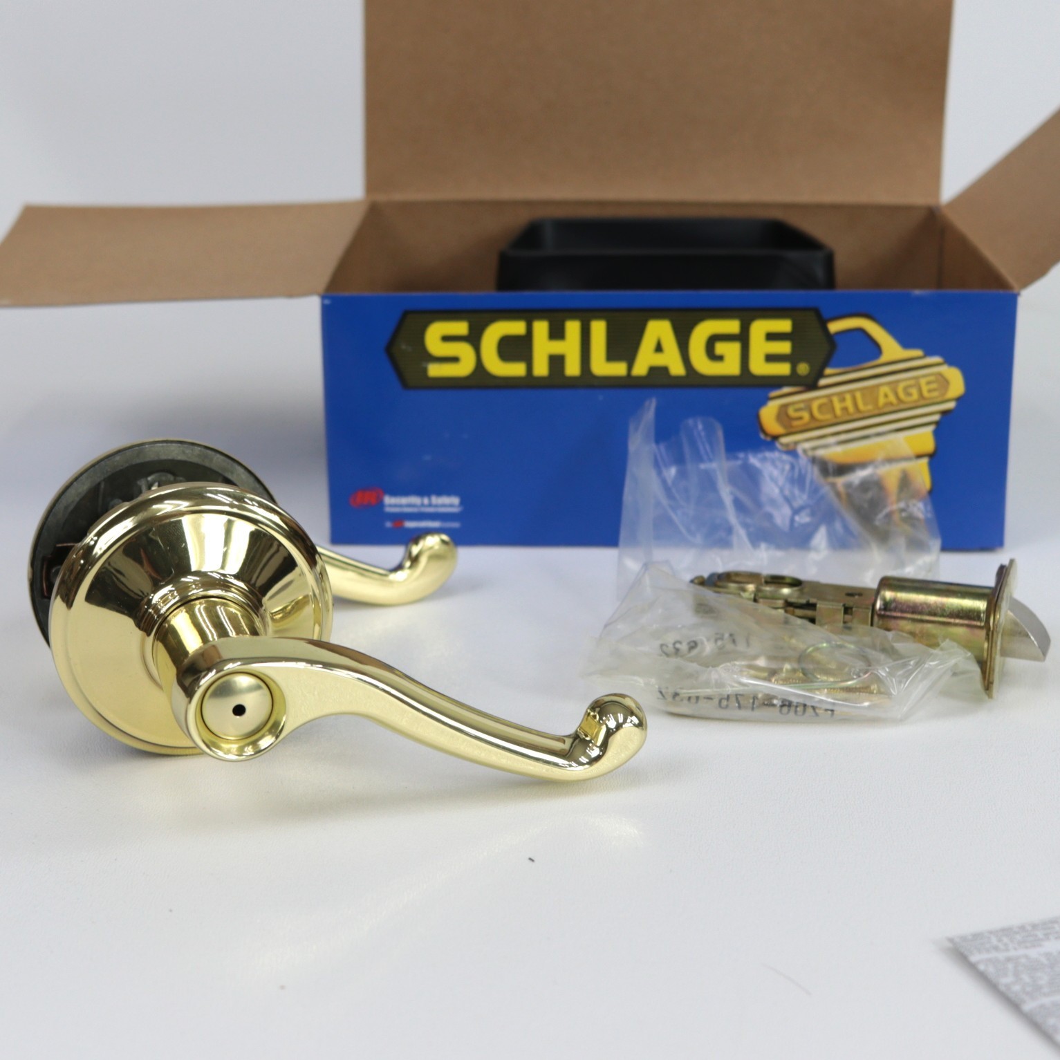 Schlage Flair Reversible Privacy Lock Lever Set in Polished Brass F40 FLA 605