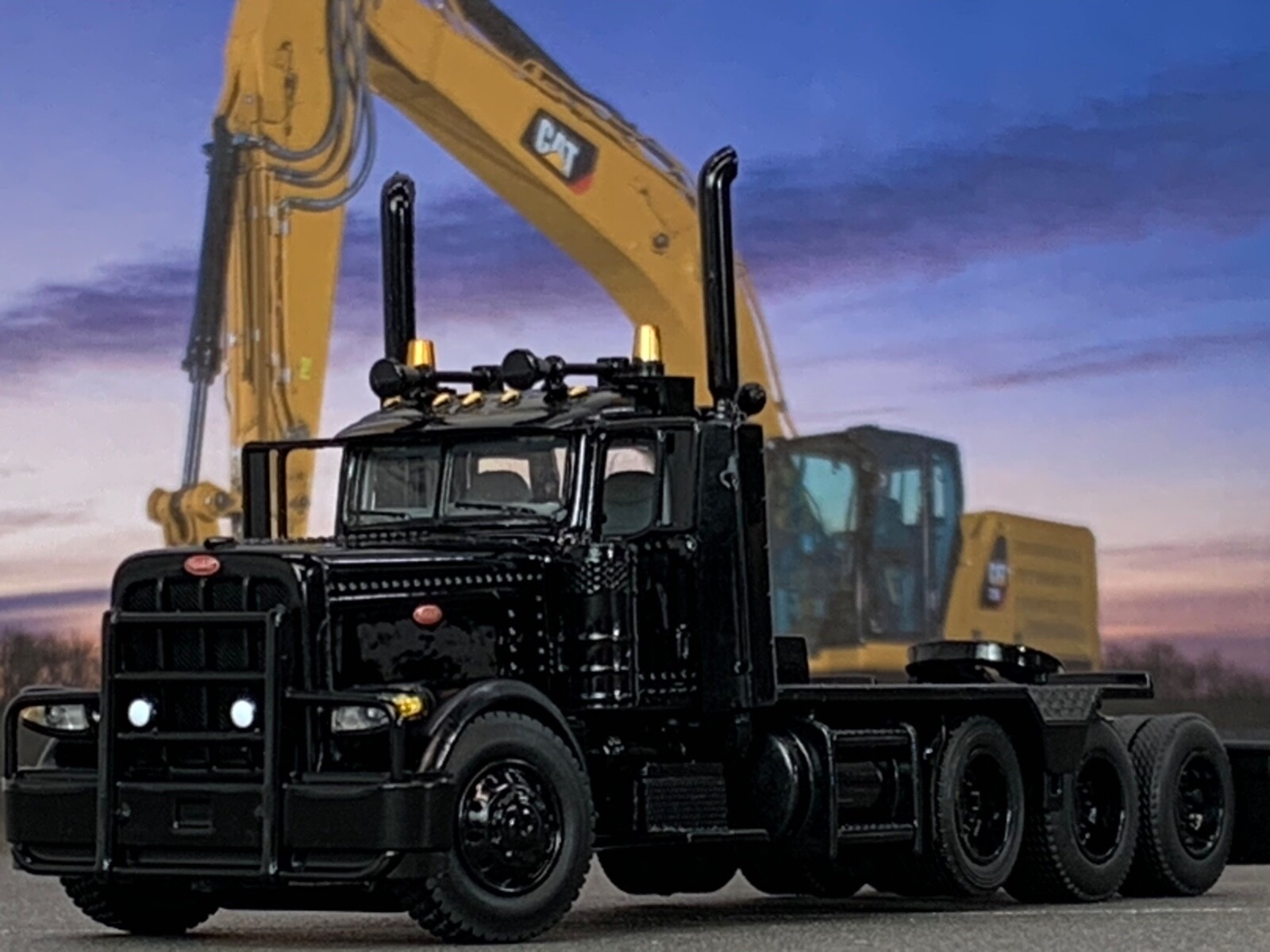 1/64 DCP ALL BLACK #2 PETERBILT 389 HEAVY HAUL TRI AXLE DAY CAB