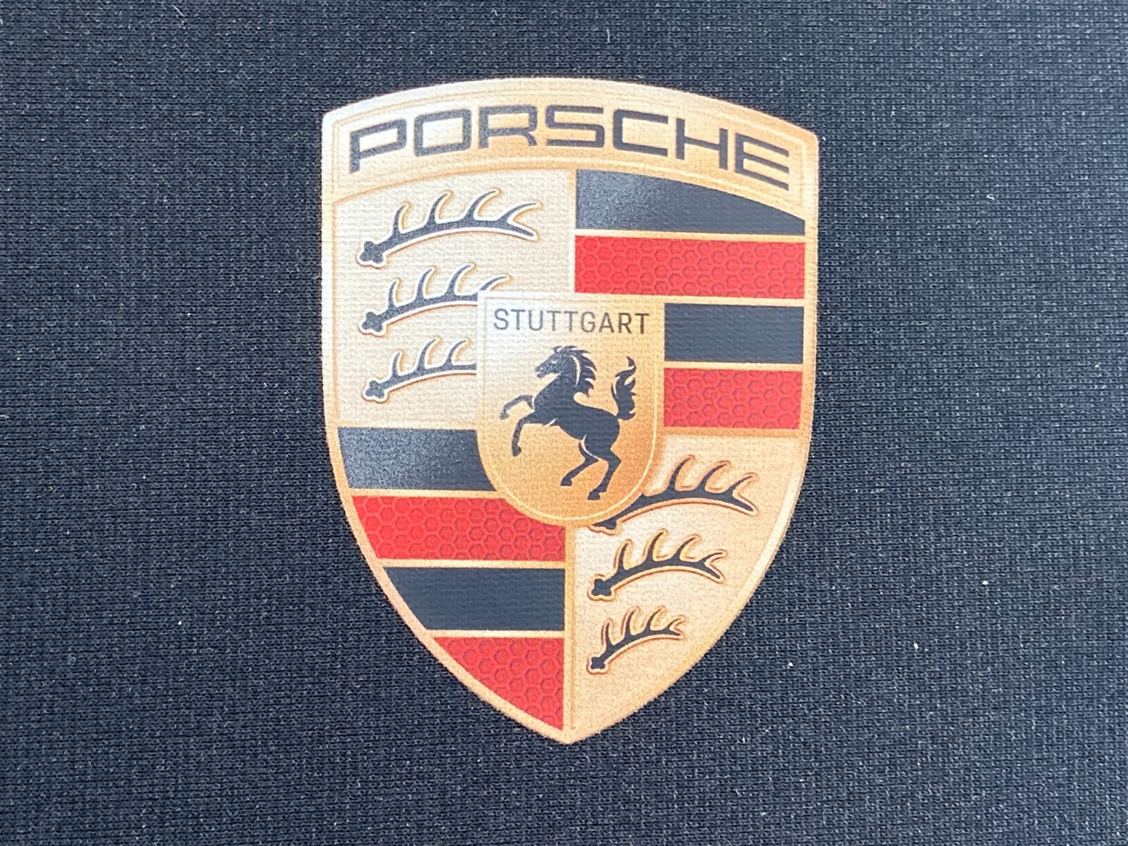 PORSCHE DESIGN OEM FACTORY STEERING WHEEL PROTECTIVE COVER IN BLACK W/CREST. NEW