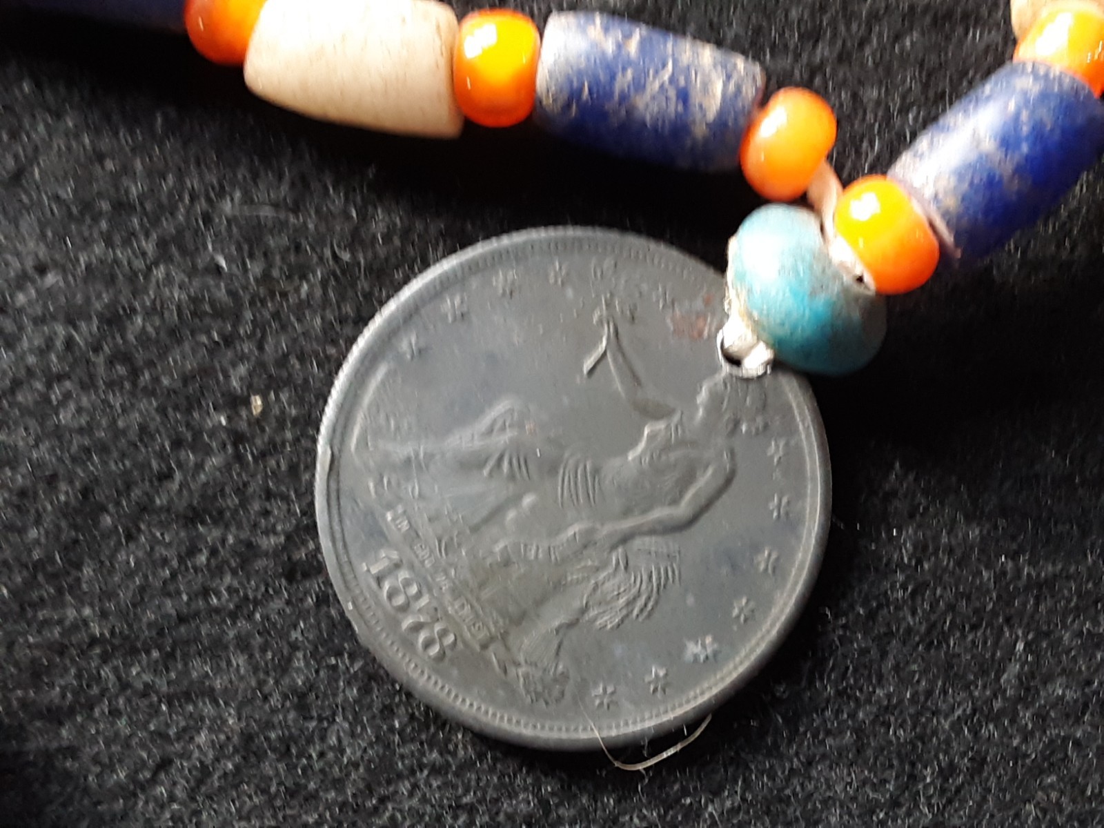 1878 TRADE DOLLAR COPY, ON LEATHER STRUNG TRADE NECKLACE, WHA-0226*09102