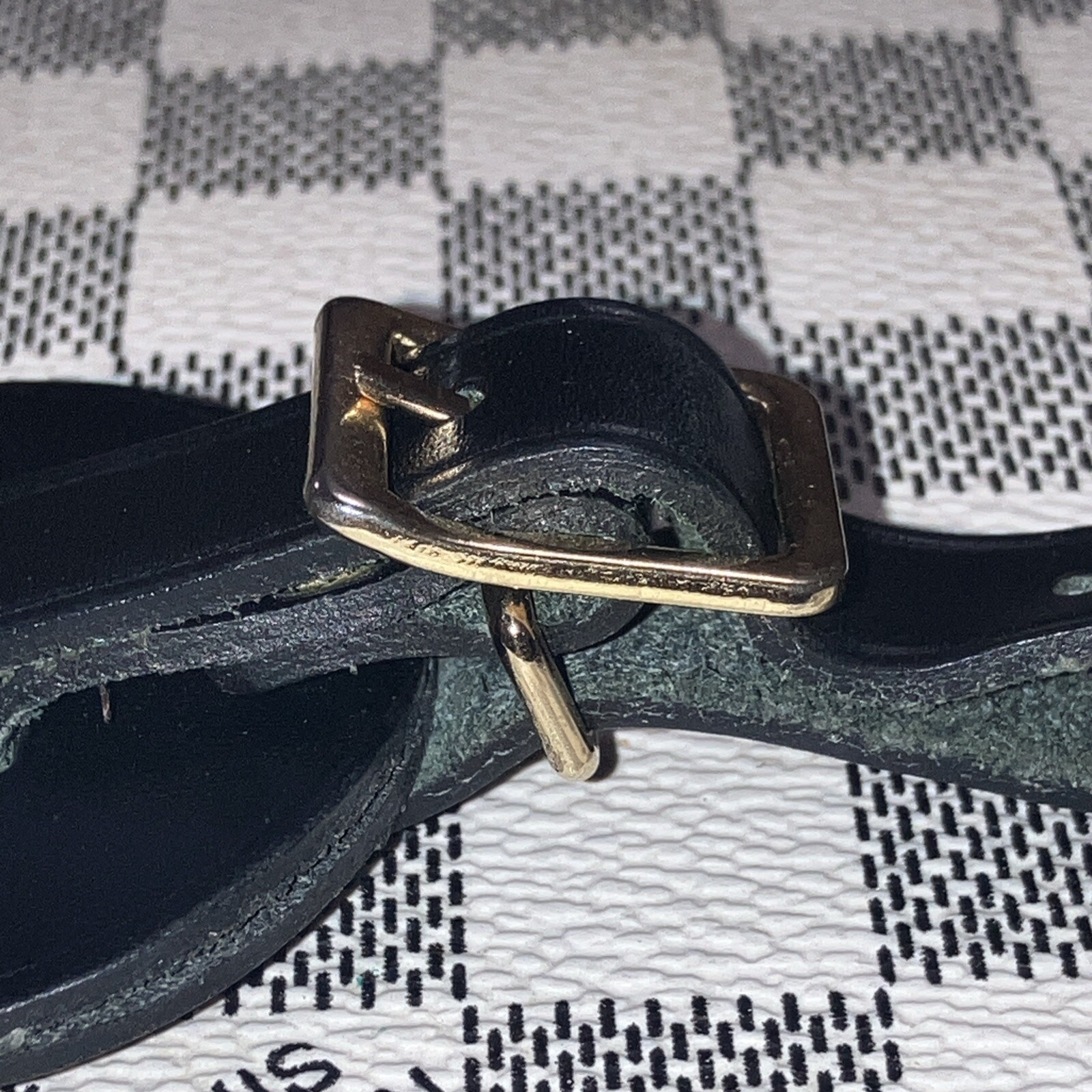 Authentic Louis Vuitton small Black W/ Gold Hardware name tag.