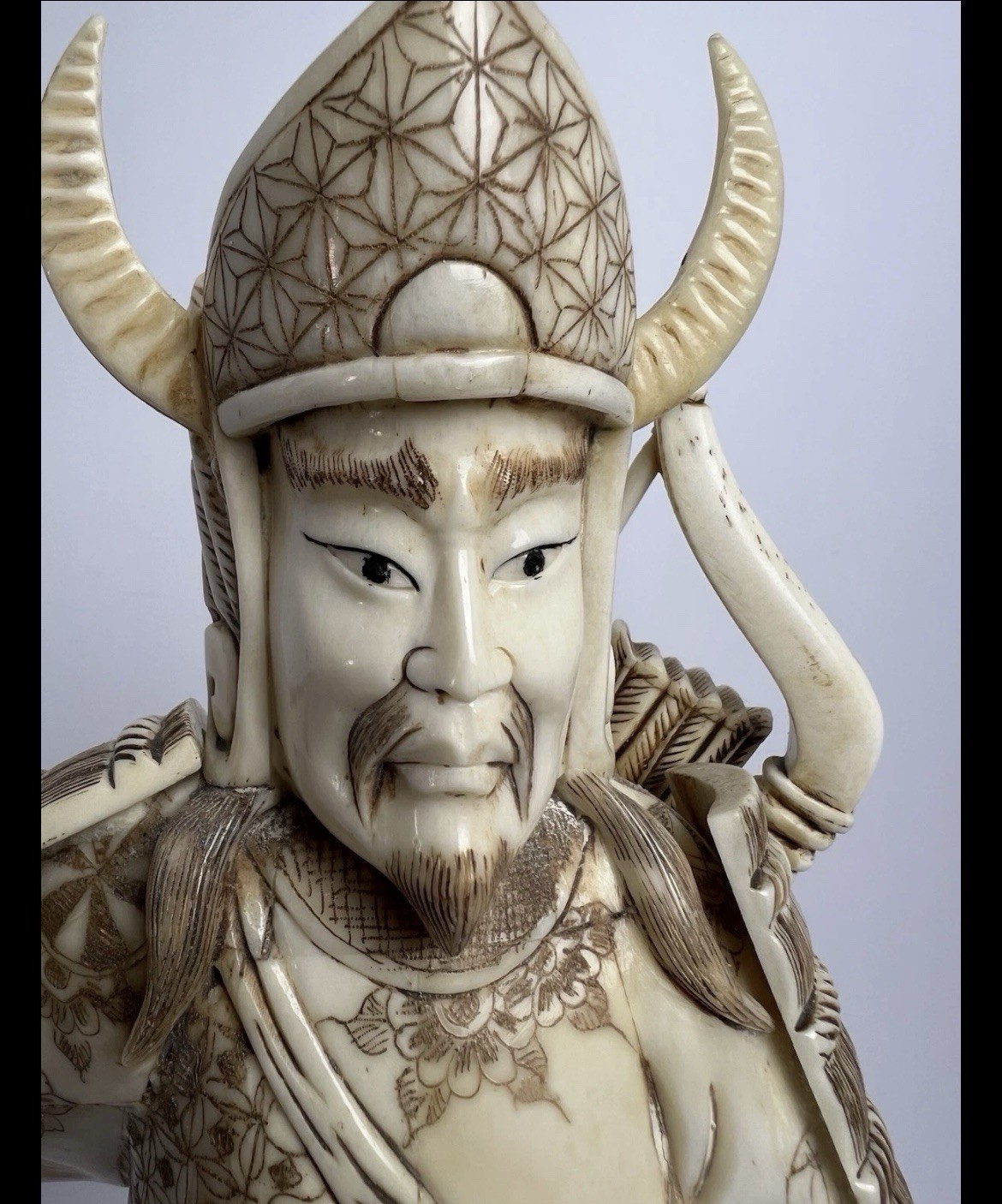 Japanese carved figure is a warrior.
