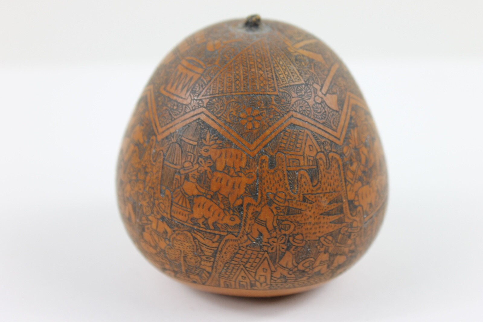 One exquisitely carved Peruvian storytelling gourd village life folk art