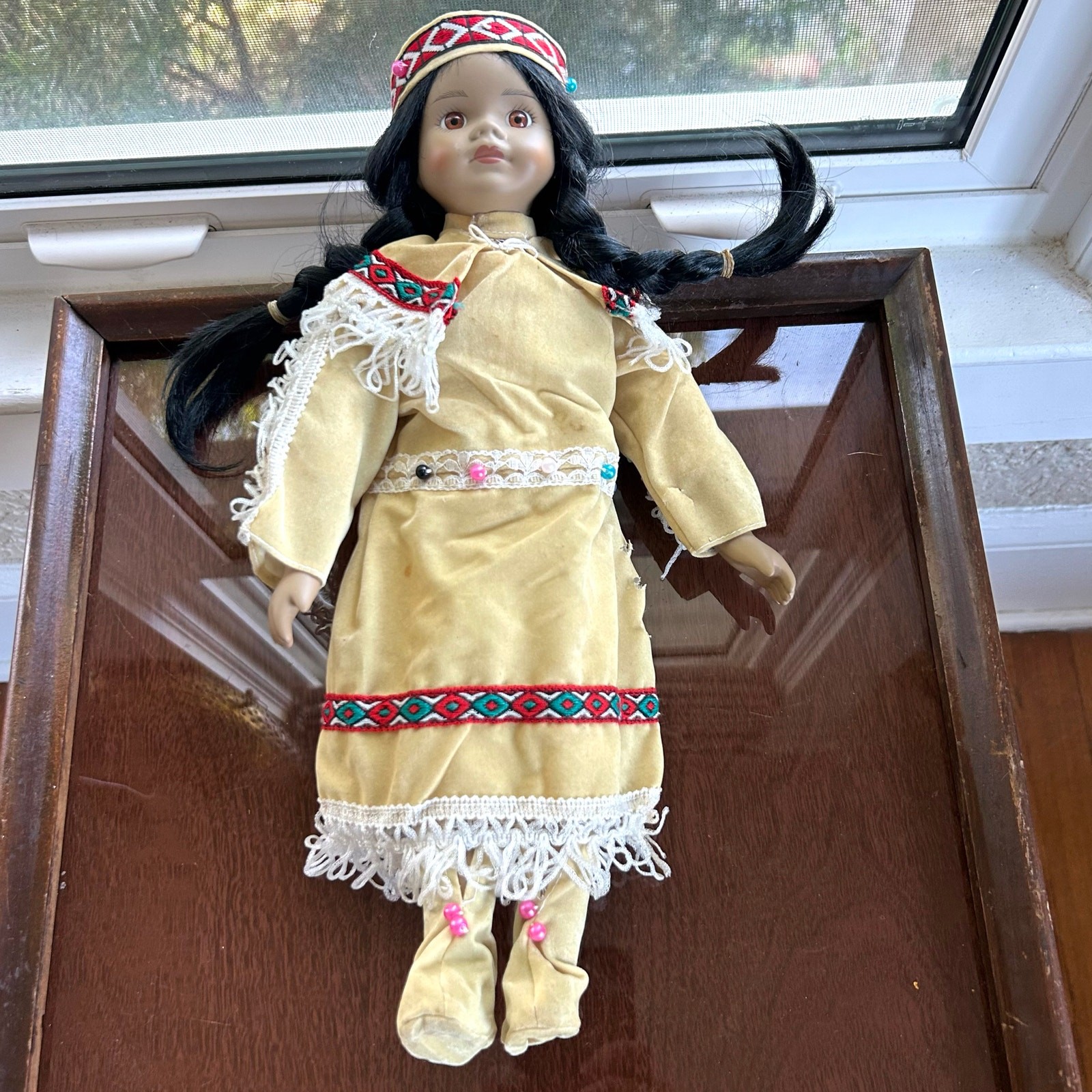Vintage Porcelain Native American-Inspired Doll with Braids and Beaded Outfit