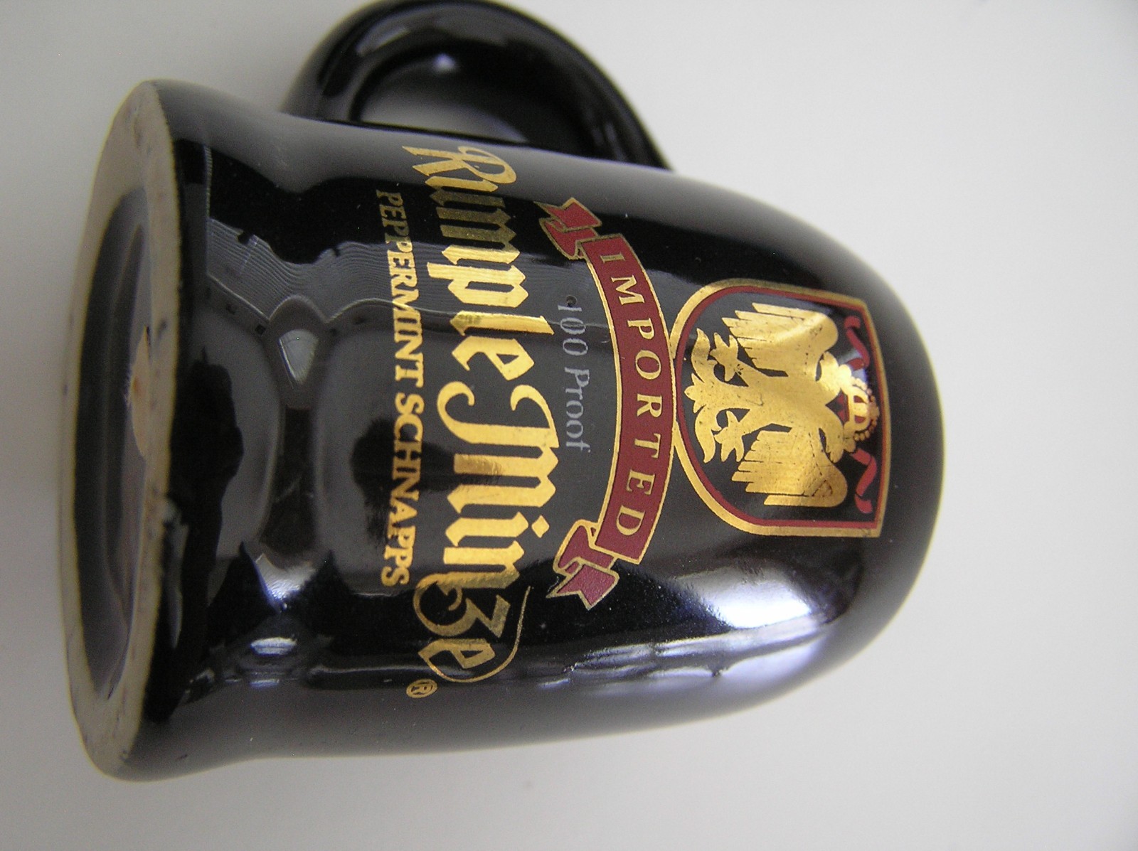 2 Souvenirs Shot Mugs: A Black Rumple Minze and A Clear Nashville 5cents Beer