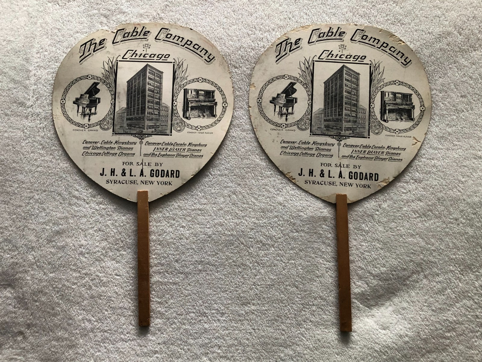 Pair of Antique paper and wood advertising fans Chicago The Cable Company Pianos