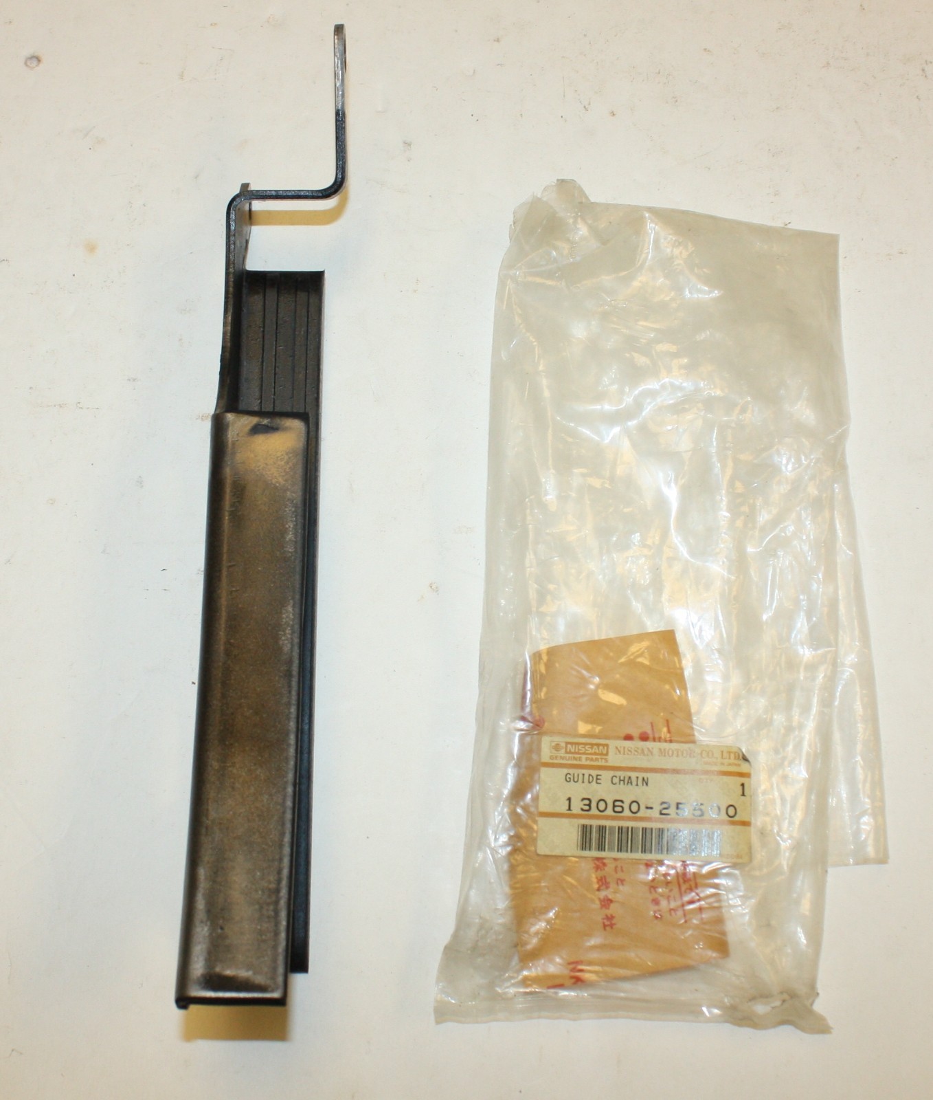 Datsun 2000 Roadster Upper Timing Chain Guide: Nissan Part 13060-25500