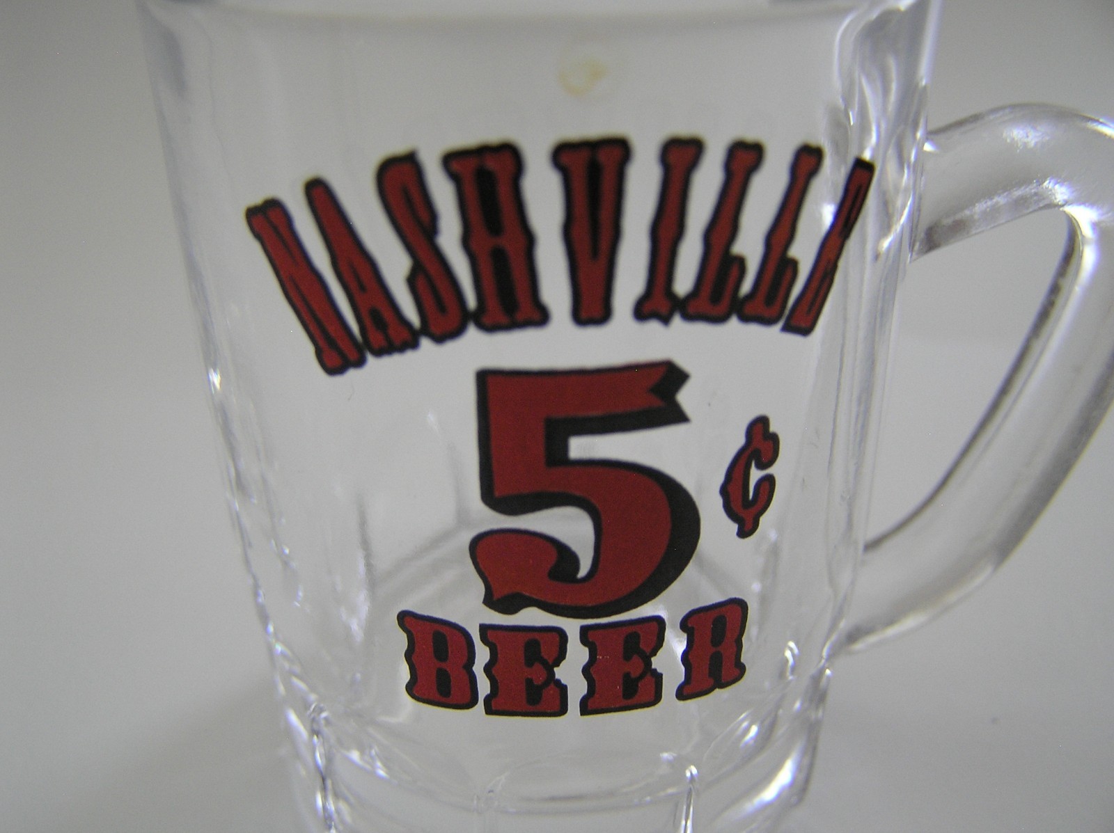 2 Souvenirs Shot Mugs: A Black Rumple Minze and A Clear Nashville 5cents Beer