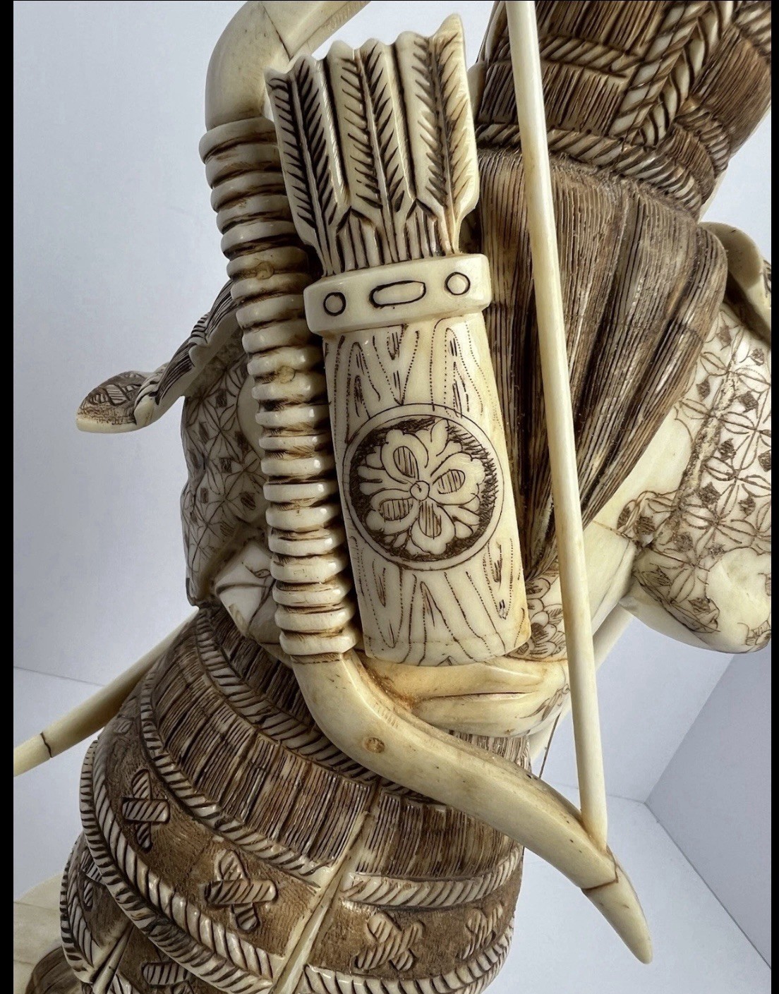 Japanese carved figure is a warrior.