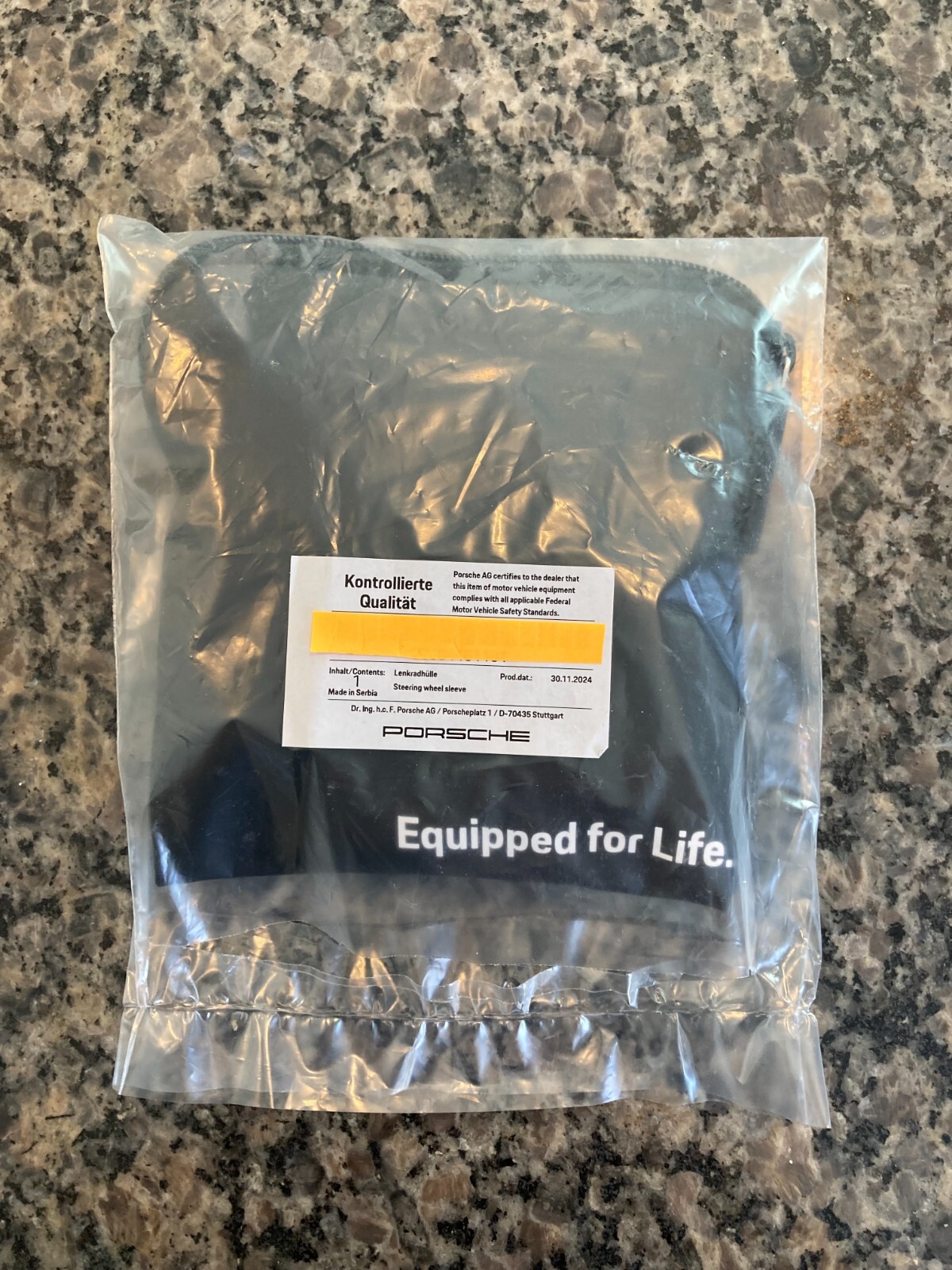 PORSCHE DESIGN OEM FACTORY STEERING WHEEL PROTECTIVE COVER IN BLACK W/CREST. NEW