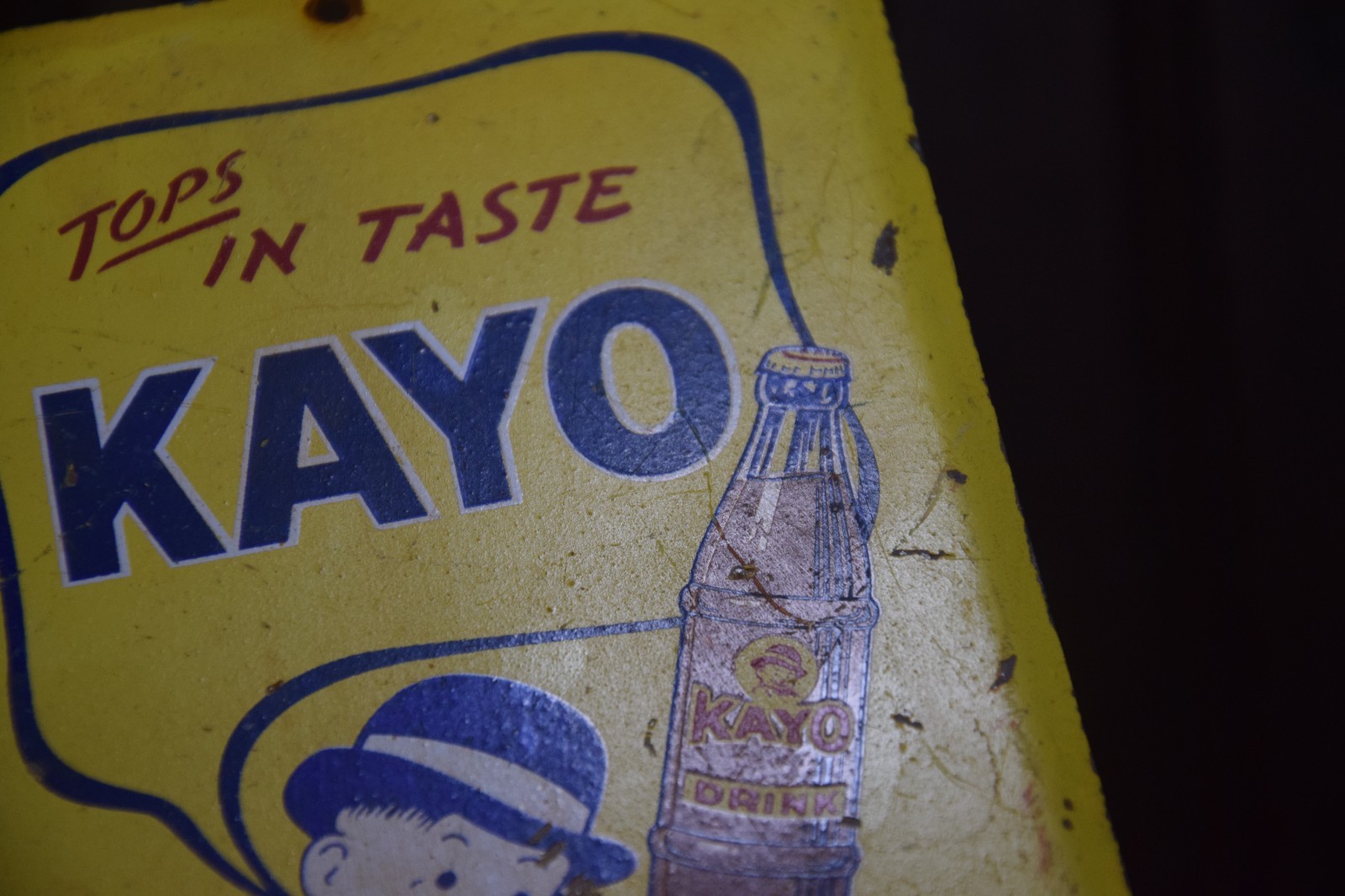 KAYO CHOCOLATE DRINK PAINTED METAL SIGN BOTTLE BOWLER MOON MULLINS CIRCA 1950s