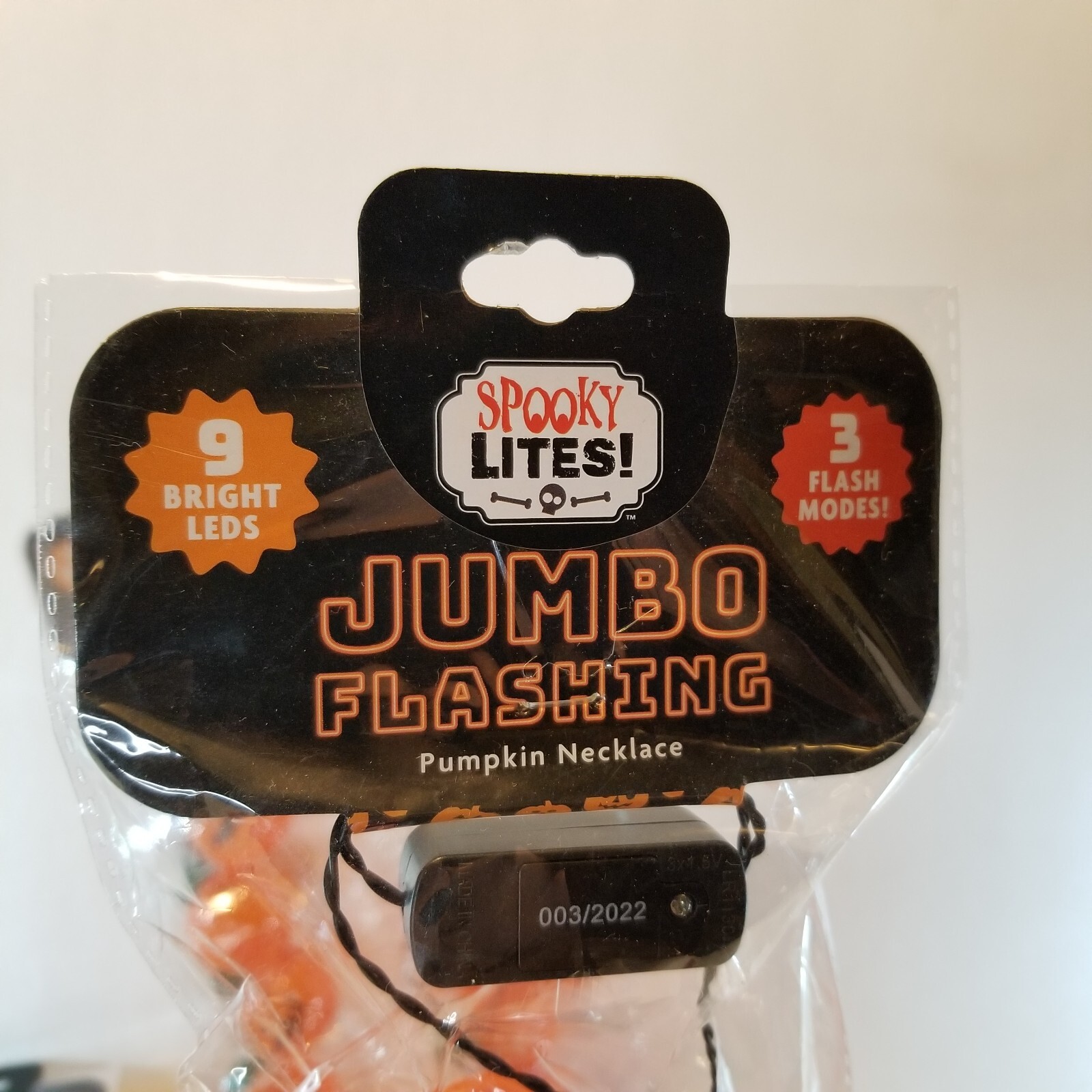 Light up Pumpkin Jack O Lantern Necklace Halloween 9 Bright LEDs 3 Flash modes.