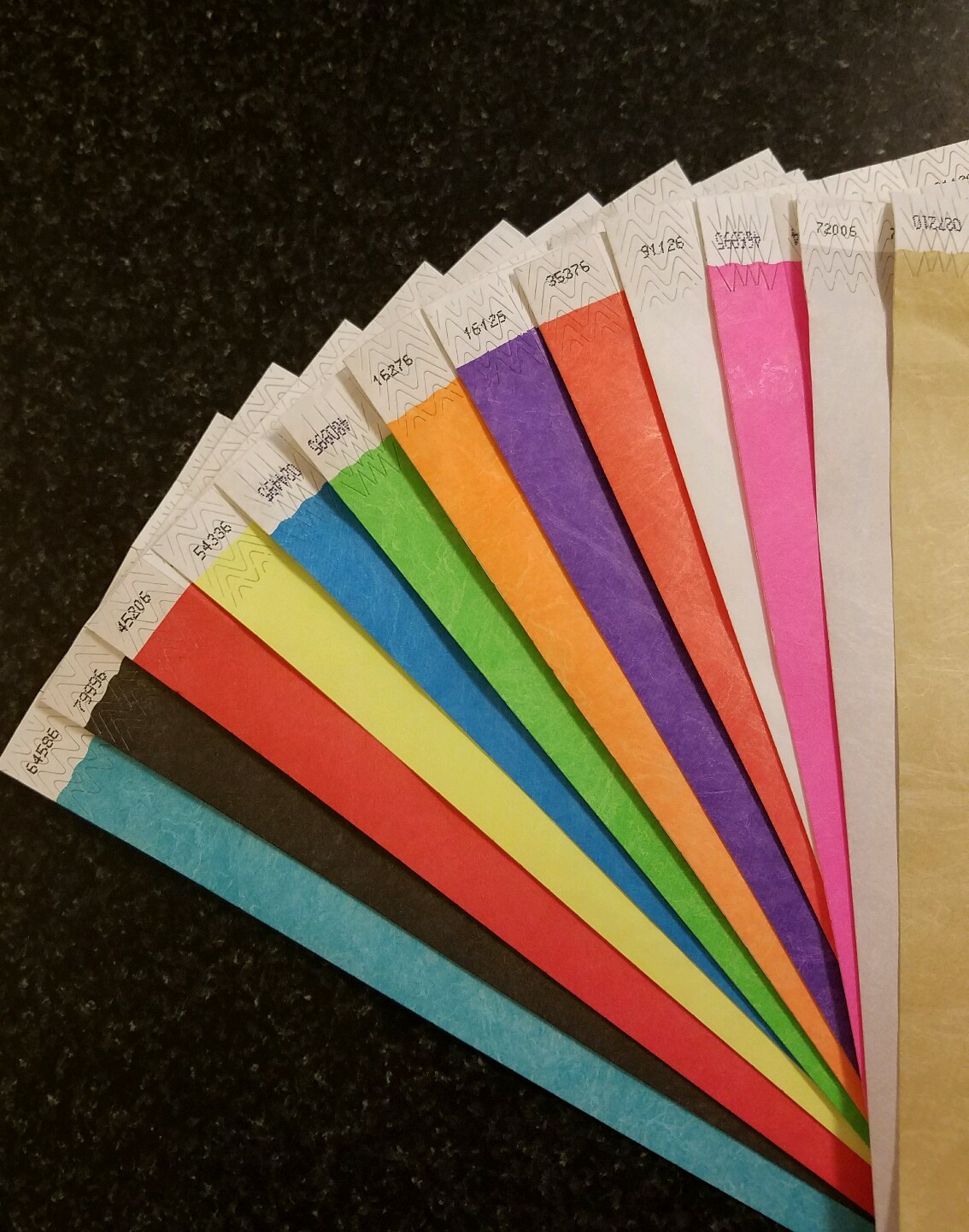 65  3/4" ASSORTED TYVEK WRISTBANDS, 5  EACH OF 13 COLORS. PAPER WRISTBANDS