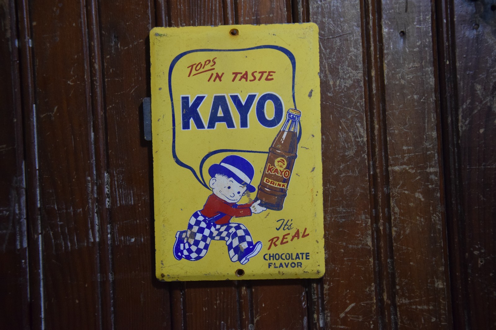 KAYO CHOCOLATE DRINK PAINTED METAL SIGN BOTTLE BOWLER MOON MULLINS CIRCA 1950s