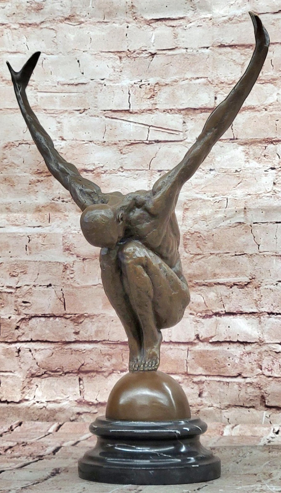 Abstract Bronze Male Figure Balancing on Sphere with Outstretched Arms Sculpture