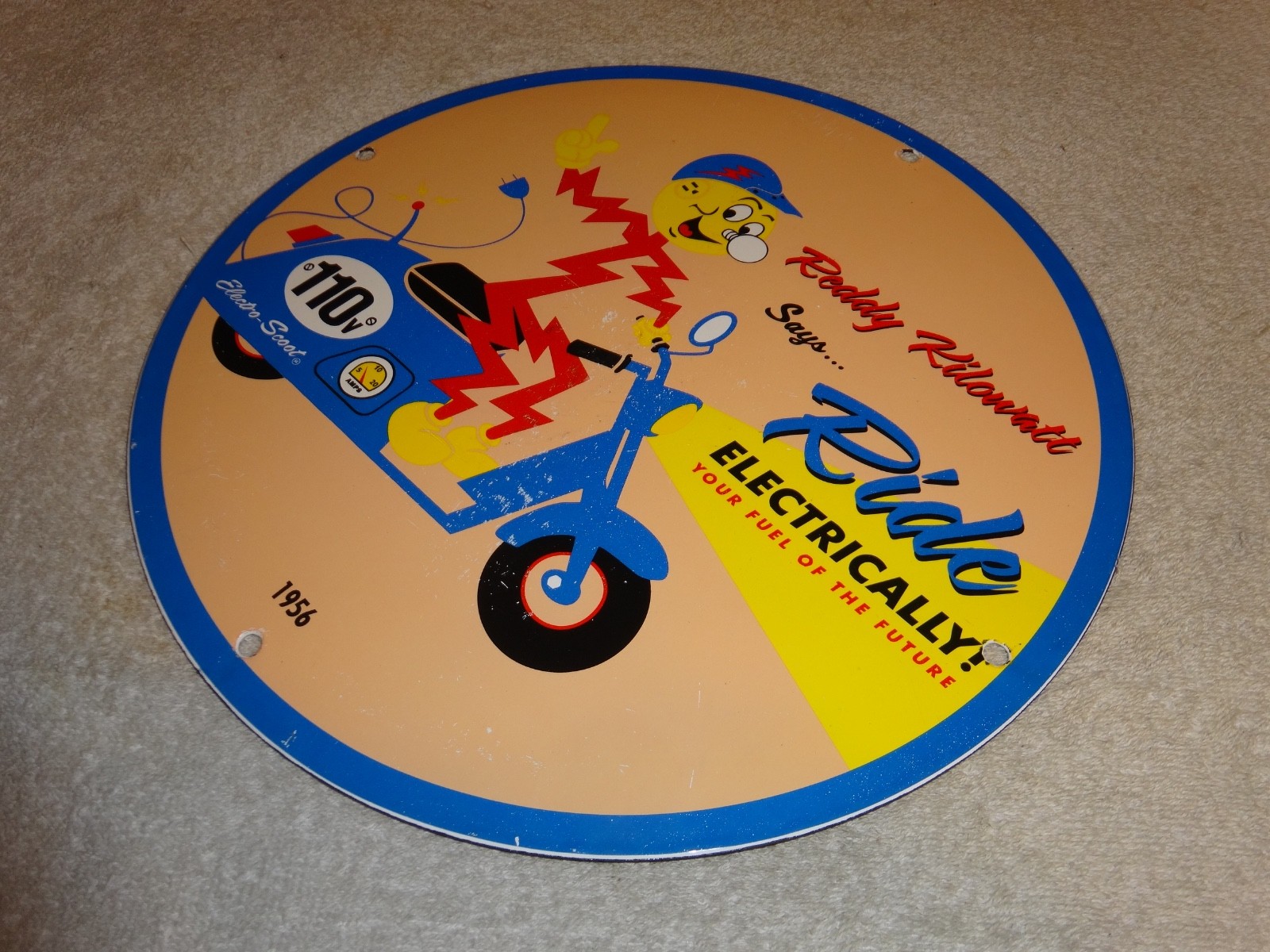 VINTAGE 56 REDDY KILOWATT ELECTRIC SCOOTER 11 3/4" PORCELAIN METAL GASOLINE SIGN