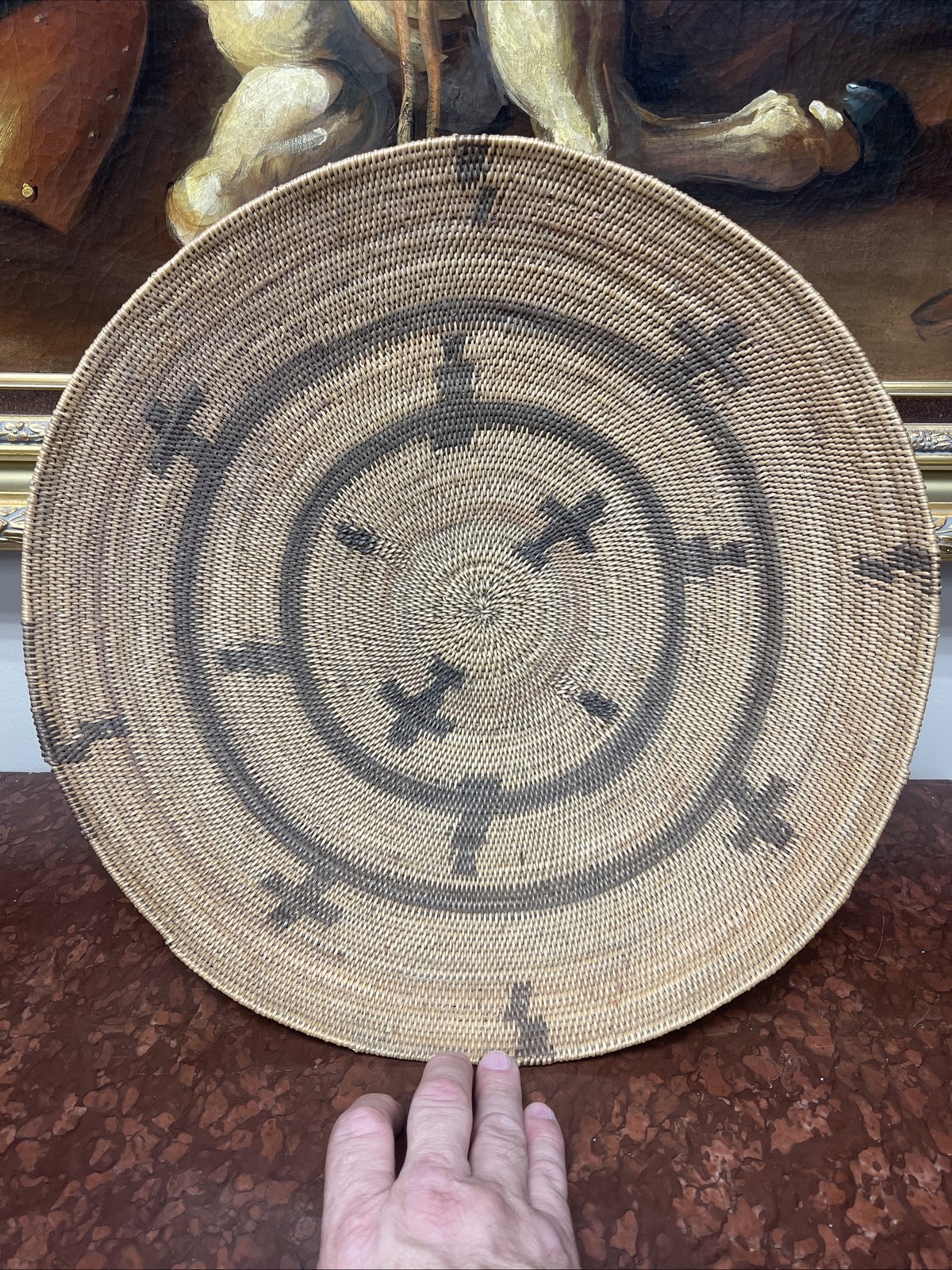 Woven Apache pictorial 17 1/4” basket with geometric and symbolic designs.