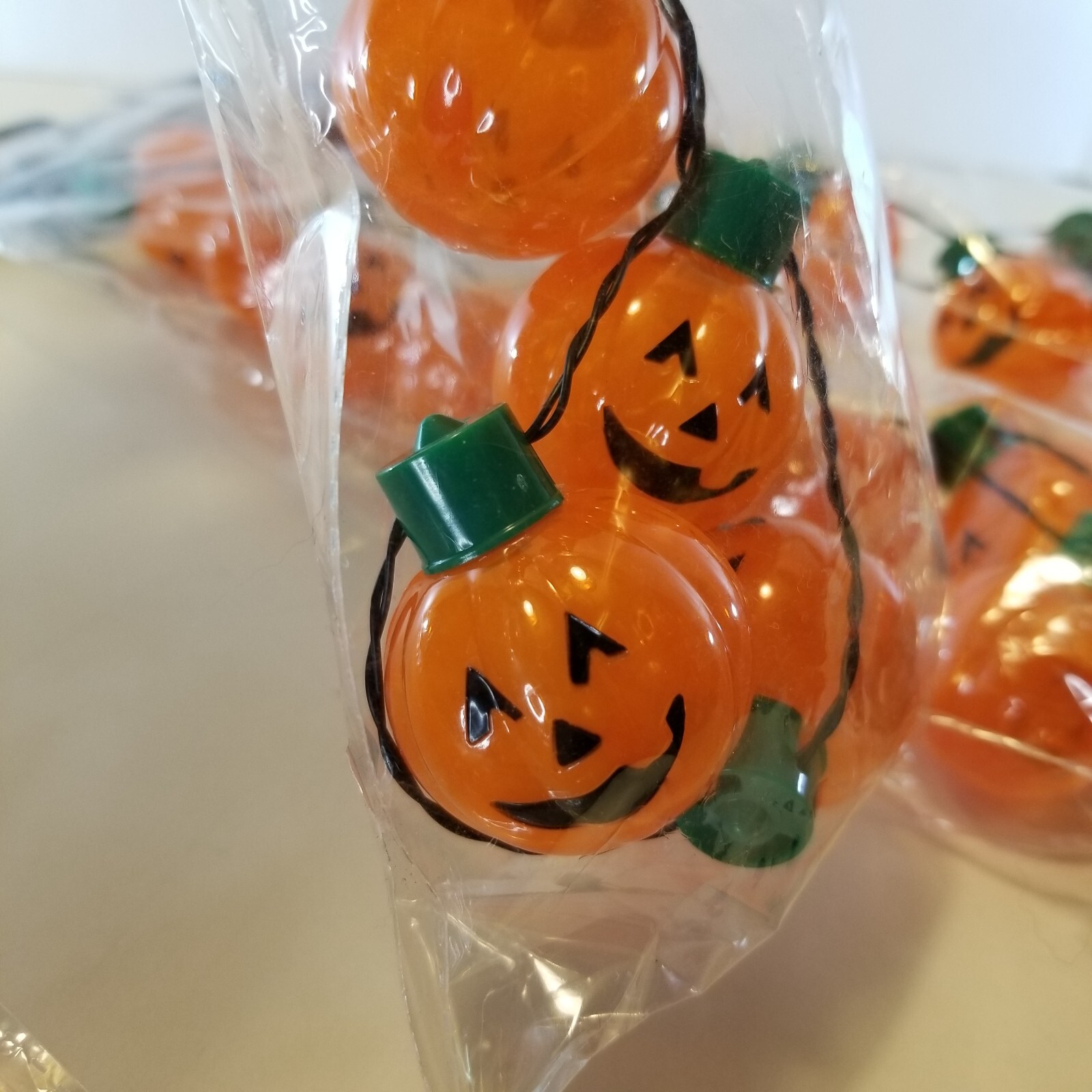 Light up Pumpkin Jack O Lantern Necklace Halloween 9 Bright LEDs 3 Flash modes.