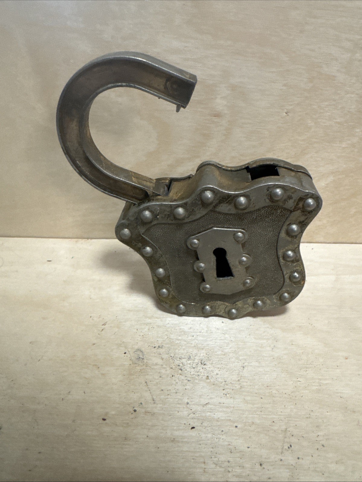 vintage Hubley Padlock Cap, a unique toy from the mid-20th century