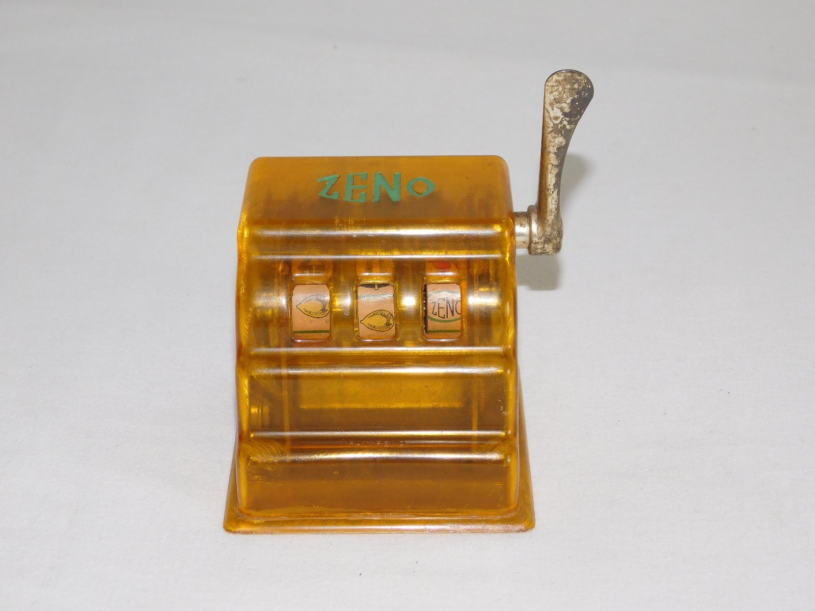 VINTAGE TRADE STIMULATOR 3 1/4" HIGH ZENO TOY SLOT MACHINE