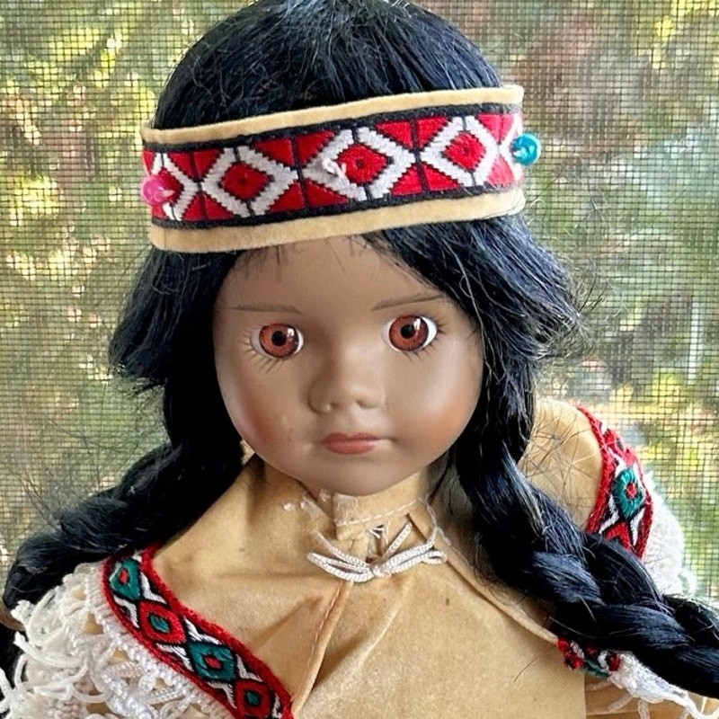 Vintage Porcelain Native American-Inspired Doll with Braids and Beaded Outfit