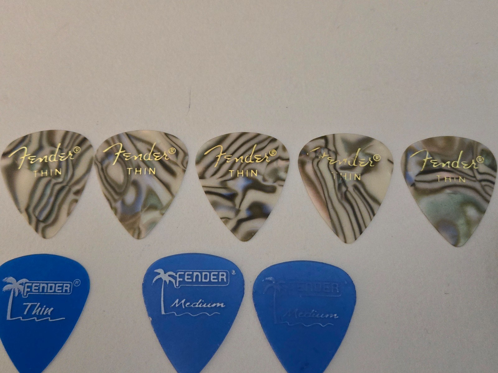 (8) 5 Celluloid 3 Lake Placid Blue Fender Guitar Picks & Jim Dunlop Pick Holder