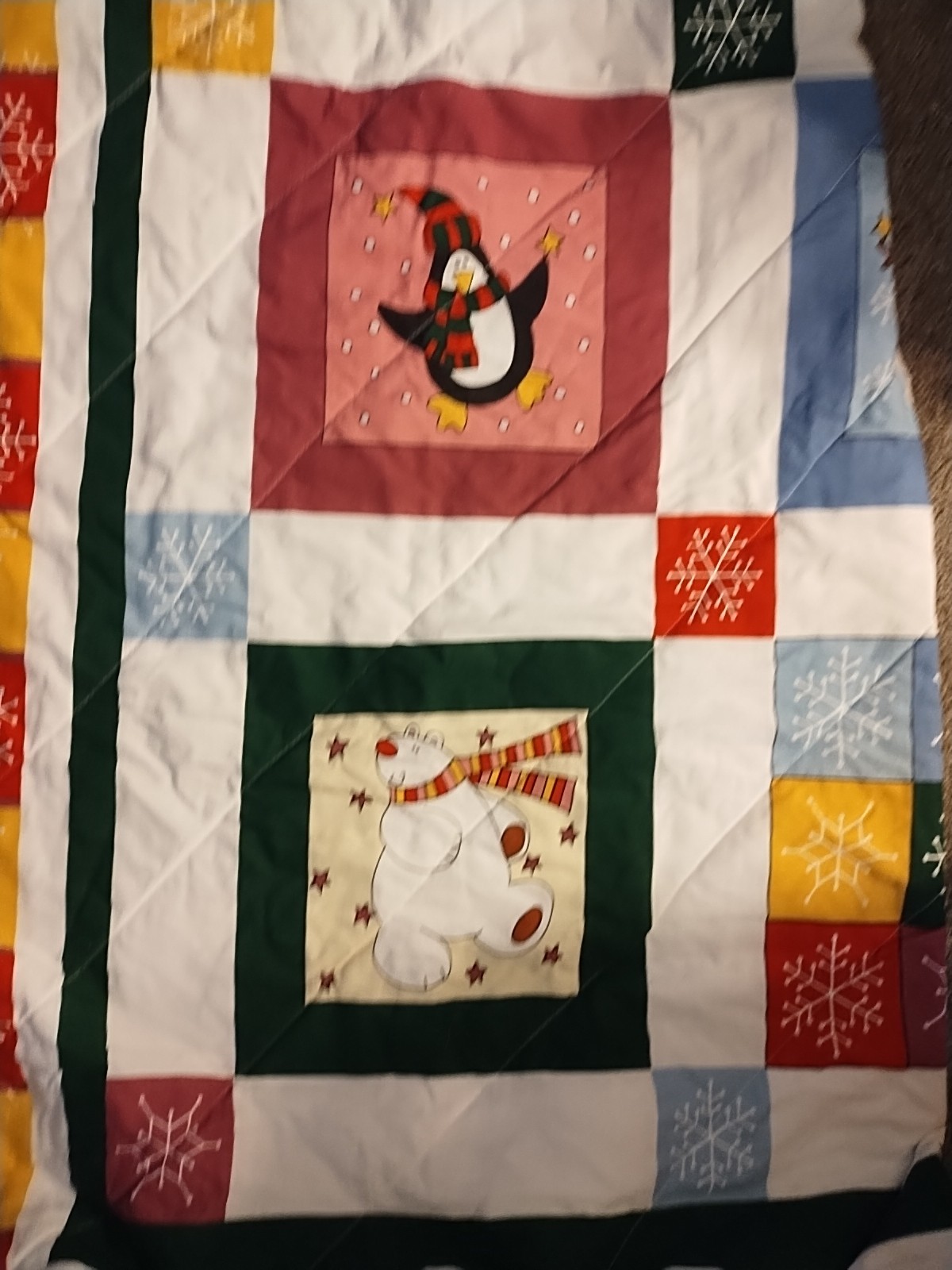 quilt featuring a winter scene with a snowman, reindeer, and penguin Q/F