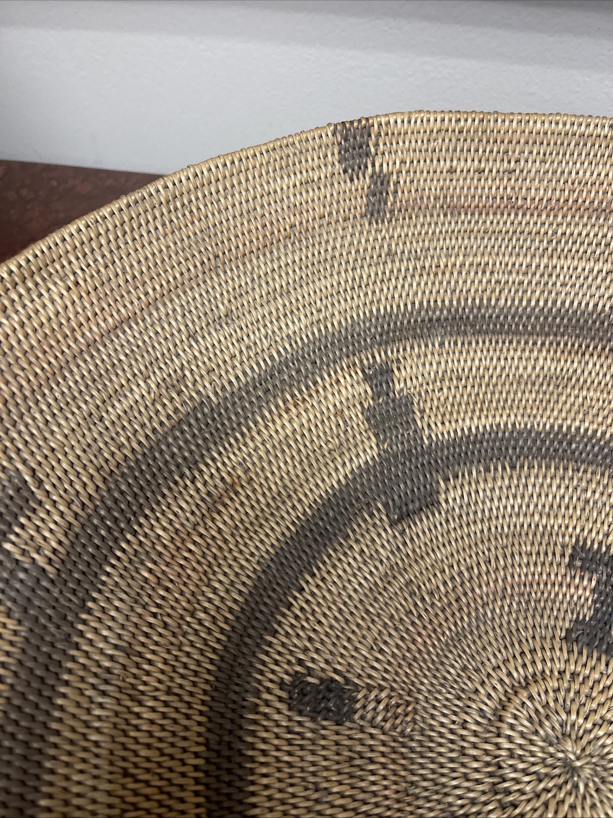 Woven Apache pictorial 17 1/4” basket with geometric and symbolic designs.