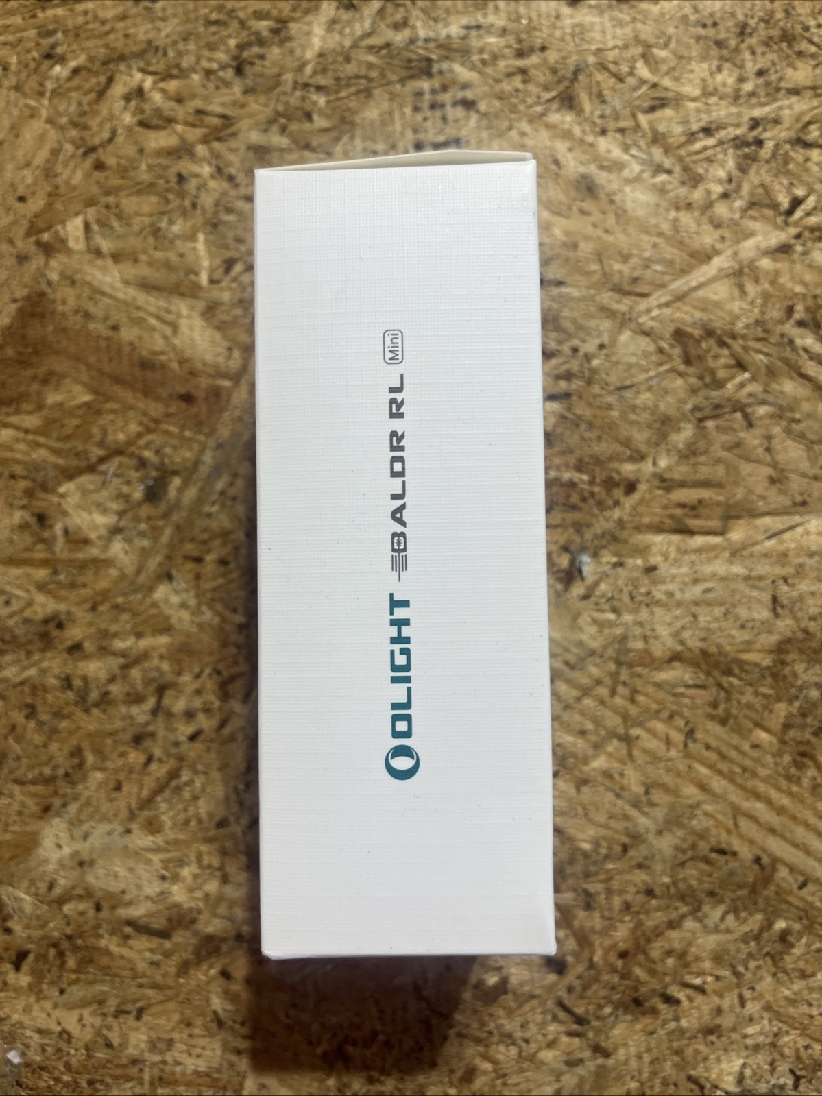 Olight Baldr RL Mini tactical light with red beam laser, black