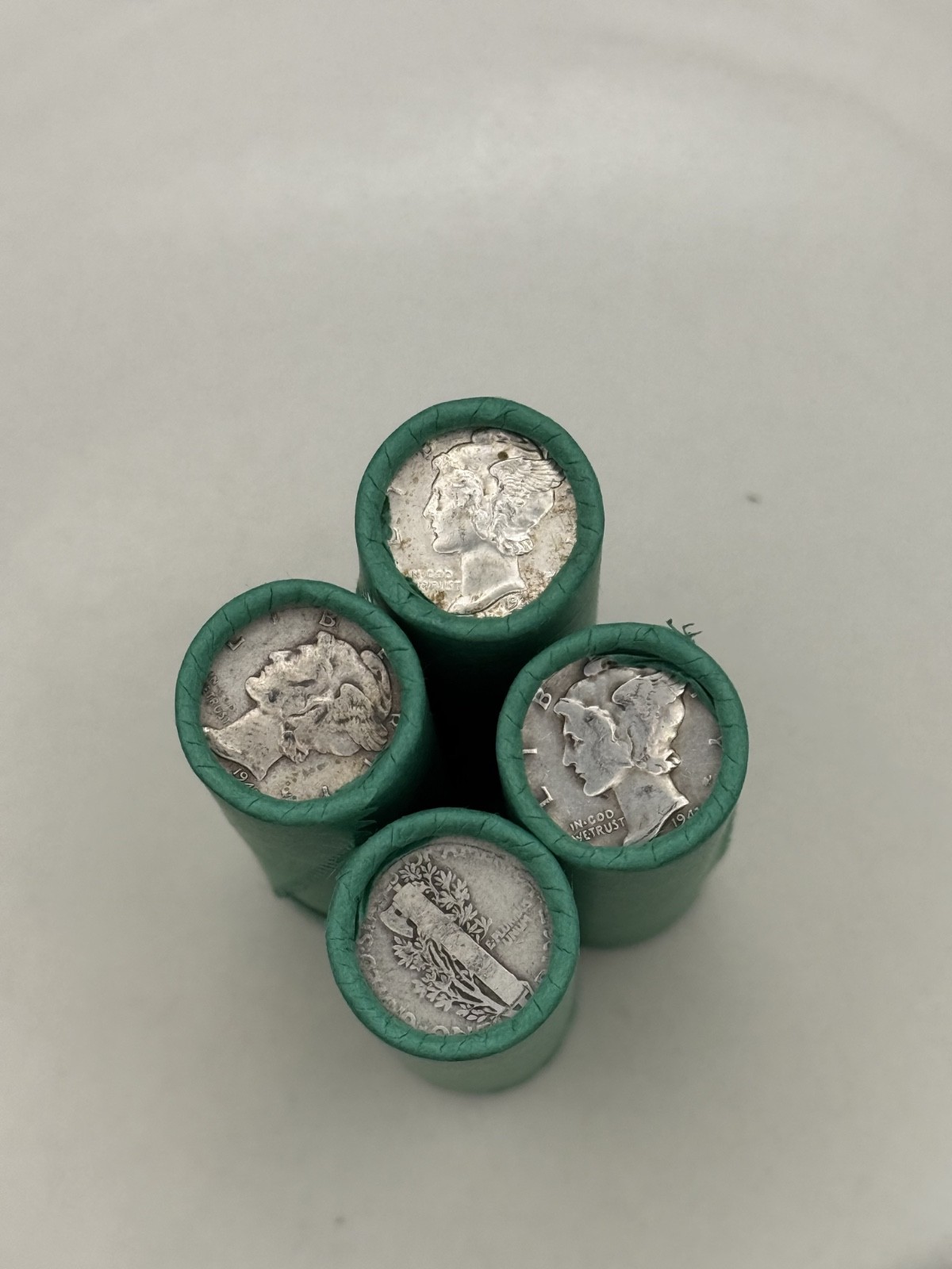 SILVER MERCURY DIME showing on old vintage unsearched green wheat penny roll us