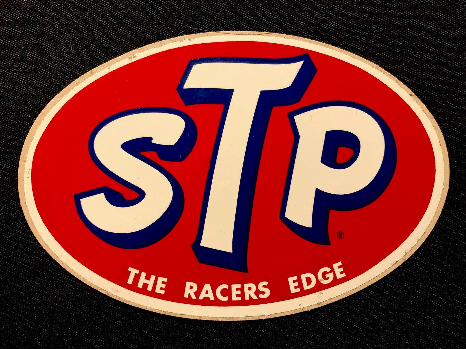 STP STICKER “THE RACERS EDGE” 4 3/4 X 3 1/4“ VINTAGE  GOOD/ MODERATE  CONDITION!