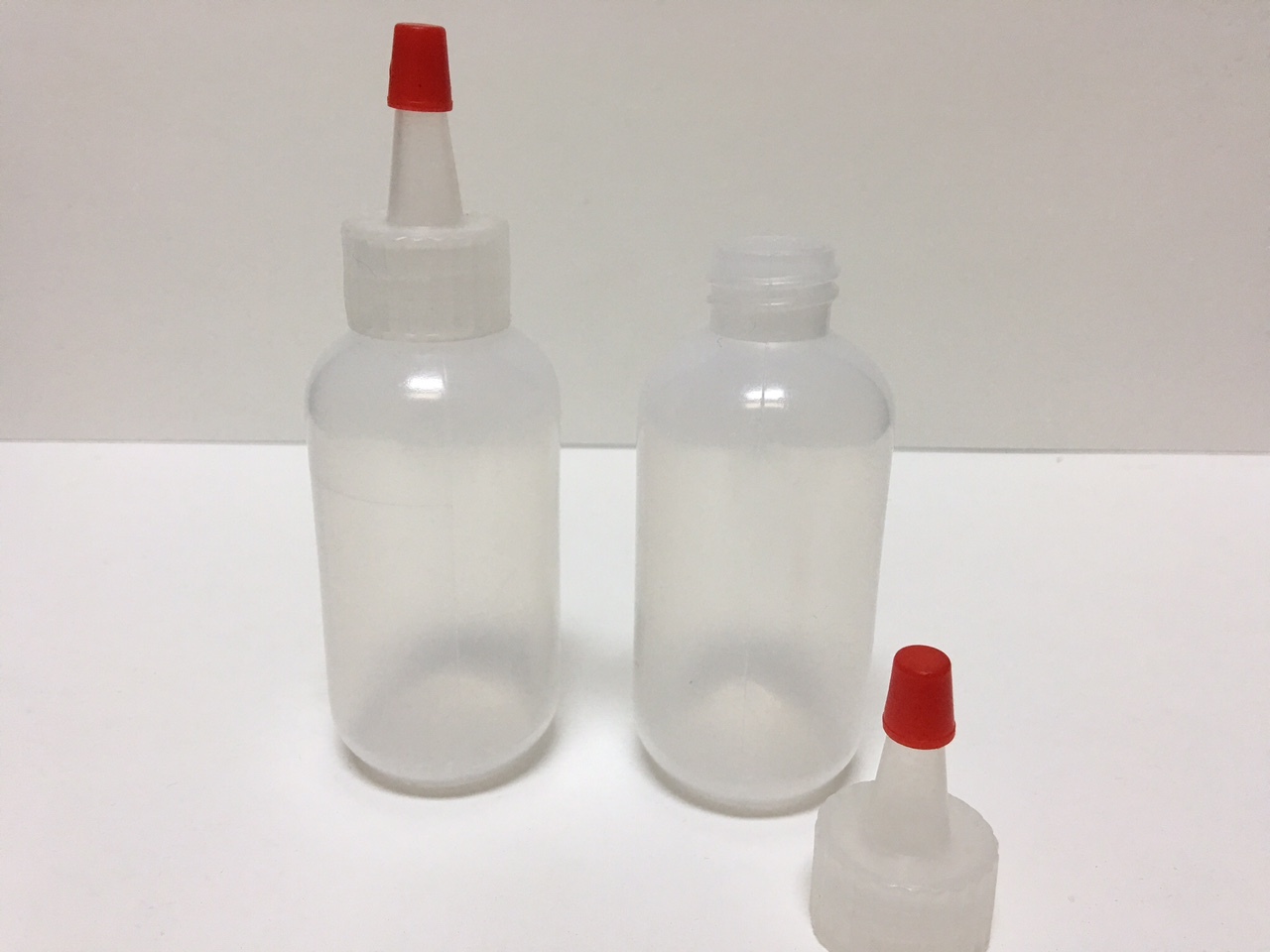 6 pack of 2oz (60mL) Plastic Boston Round Squeeze Bottles with Yorker Caps HDPE