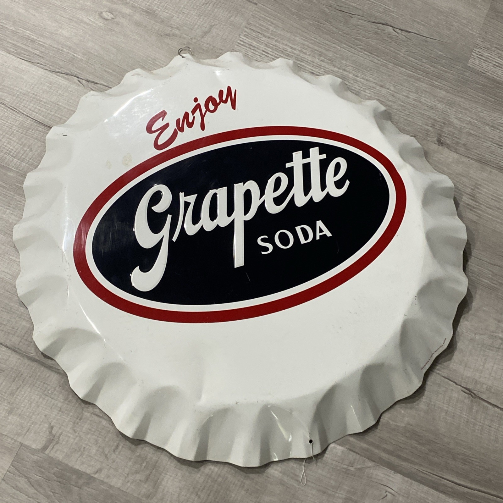 Grapette Bottle Cap Sign Metal Embossed 26.5” Stout Sign Co