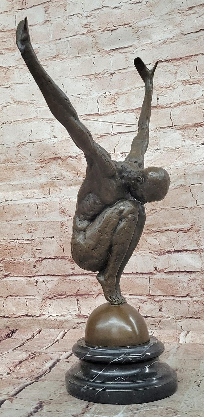Abstract Bronze Male Figure Balancing on Sphere with Outstretched Arms Sculpture