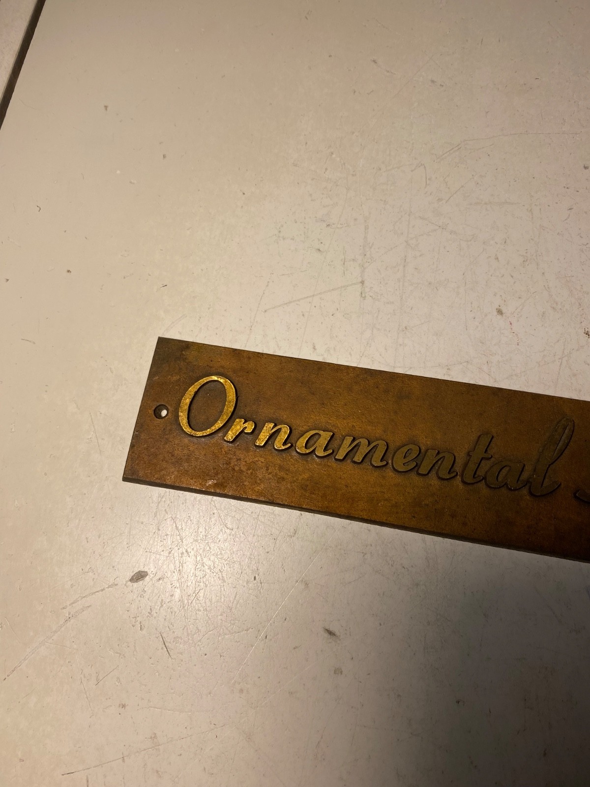 Vintage Metal Ornamental Hooks Sign Plaque